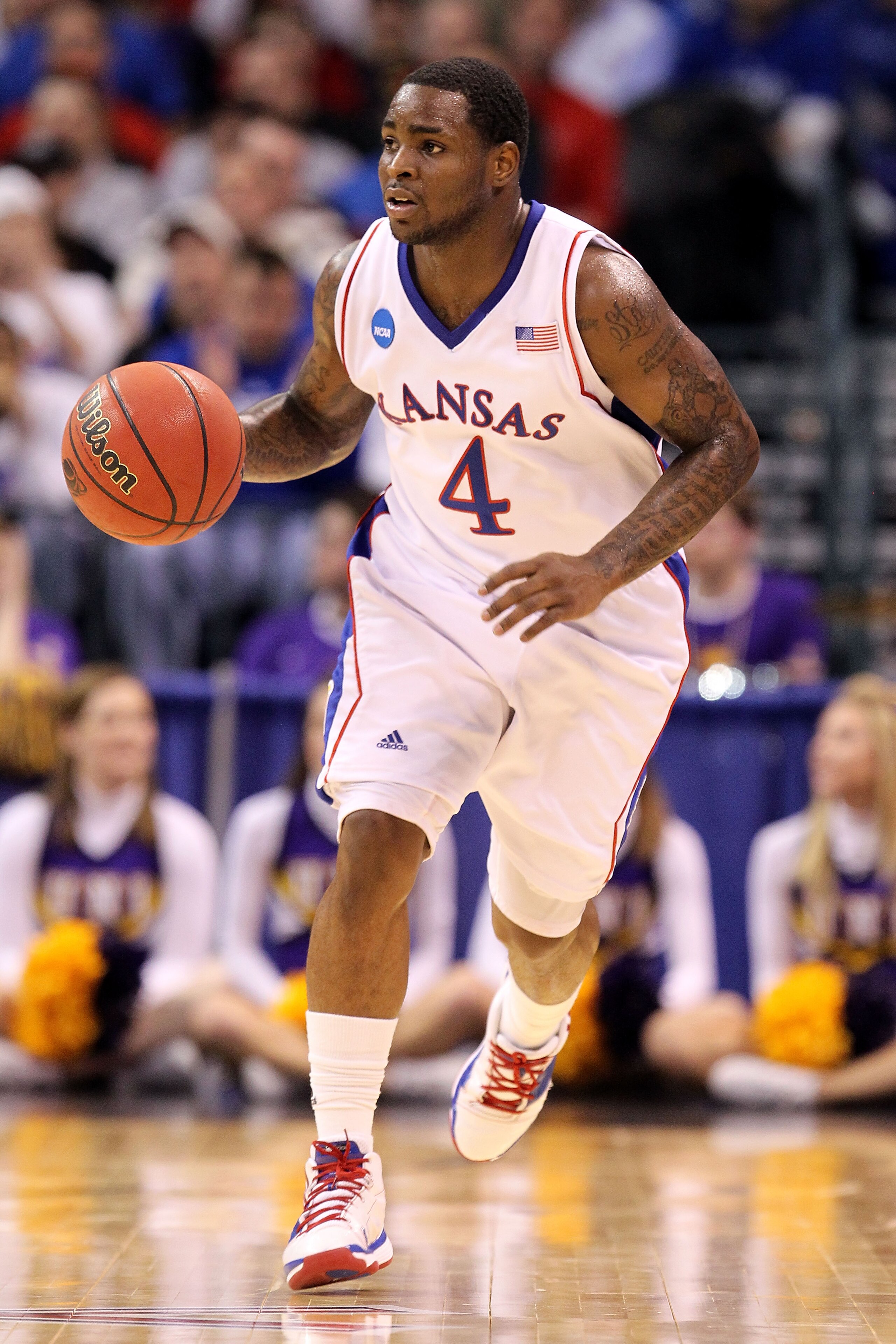 OKLAHOMA CITY - MARCH 20:  Sherron Collins #4 of the Kansas Jayhawks brings the ball up court against the Northern Iowa Panthers during the second round of the 2010 NCAA men's basketball tournament at Ford Center on March 20, 2010 in Oklahoma City, Oklaho