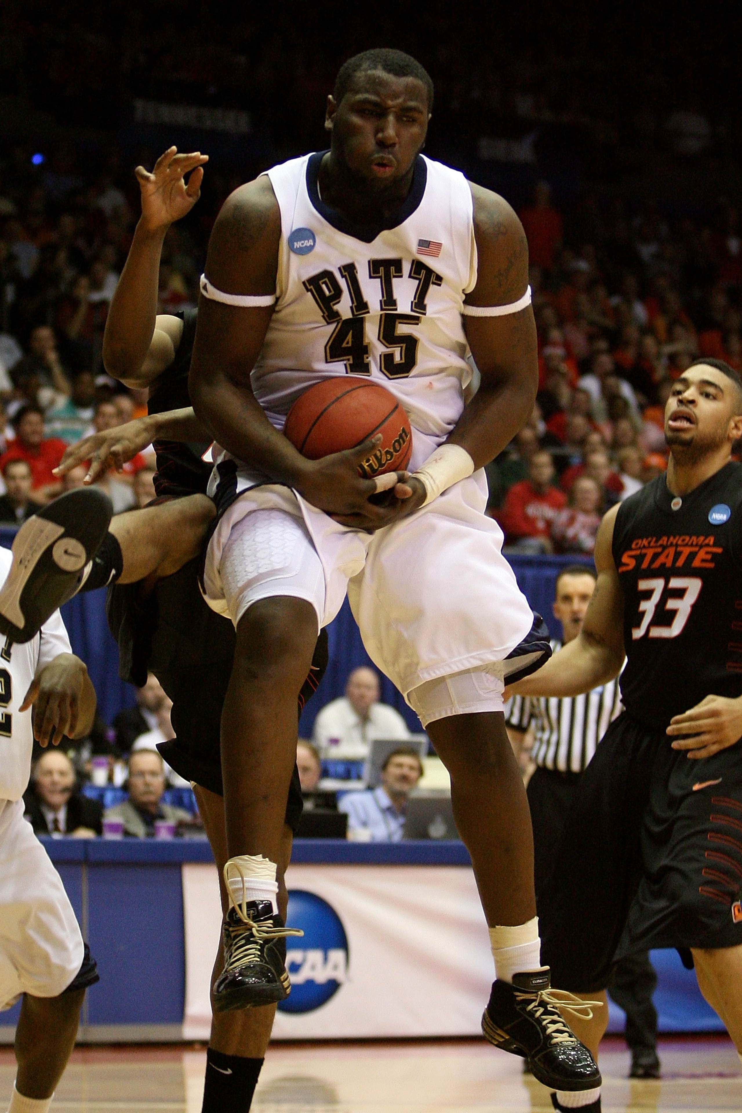 DAYTON, OH - MARCH 22: DeJuan Blair #45 of the Pittsburgh Panthers pulls down a rebound against the Oklahoma State Cowboys during the second round of the NCAA Division I Men's Basketball Tournament at the University of Dayton Arena on March 22, 2009 in Da