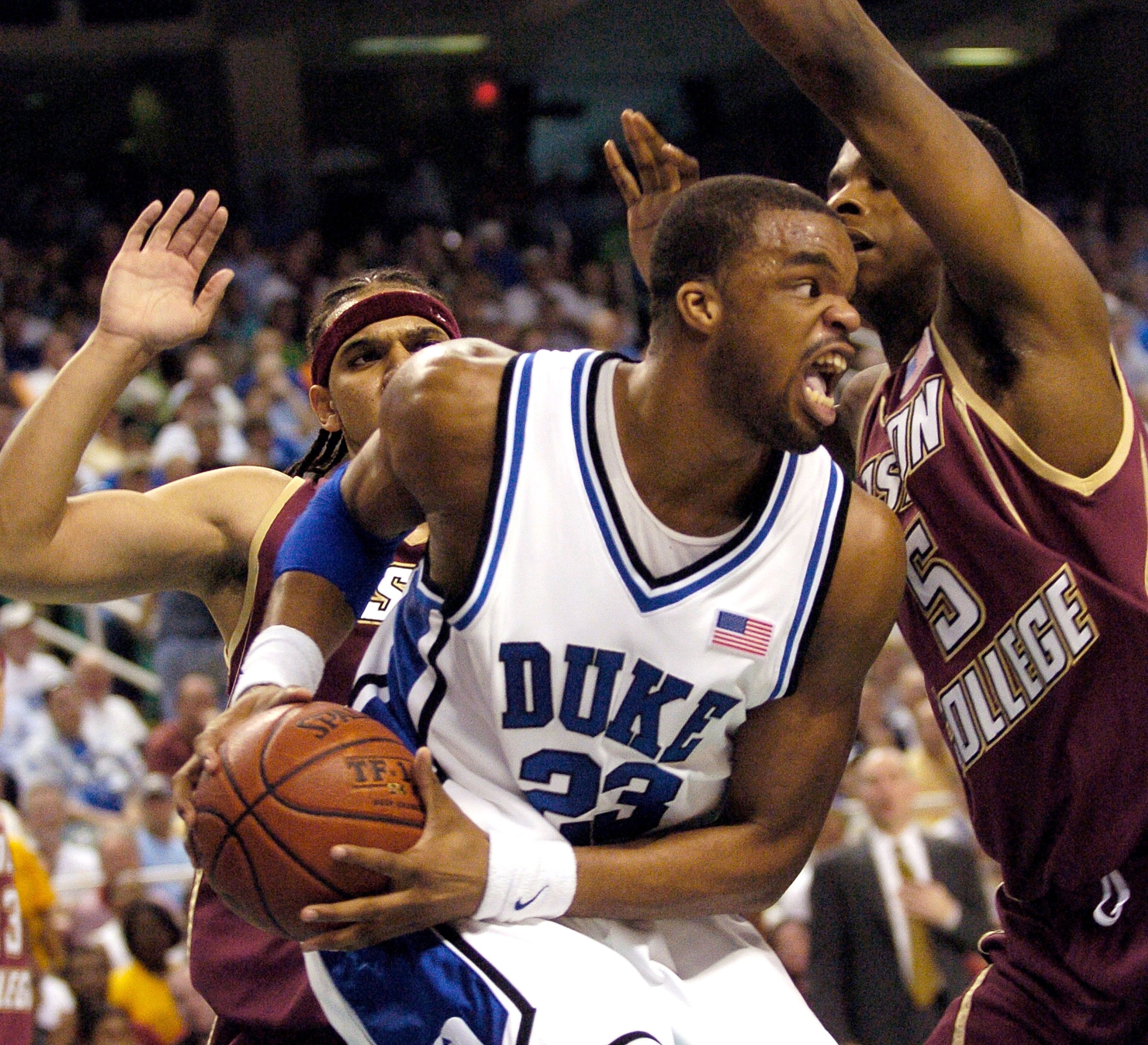 GREENSBORO, NC - MARCH 12: Jared Dudley #3 (L) and Akida McLain #5 (R) of the Boston College Eagles defend Shelden Williams #23 of the Duke Blue Devils during the finals of the Atlantic Coast Conference Men's Basketball Tournament on March 12, 2006 at th GREENSBORO, NC - MARCH 12: Jared Dudley #3 (L) and Akida McLain #5 (R) of the Boston College Eagles defend Shelden Williams #23 of the Duke Blue Devils during the finals of the Atlantic Coast Conference Men's Basketball Tournament on March 12, 2006 at th