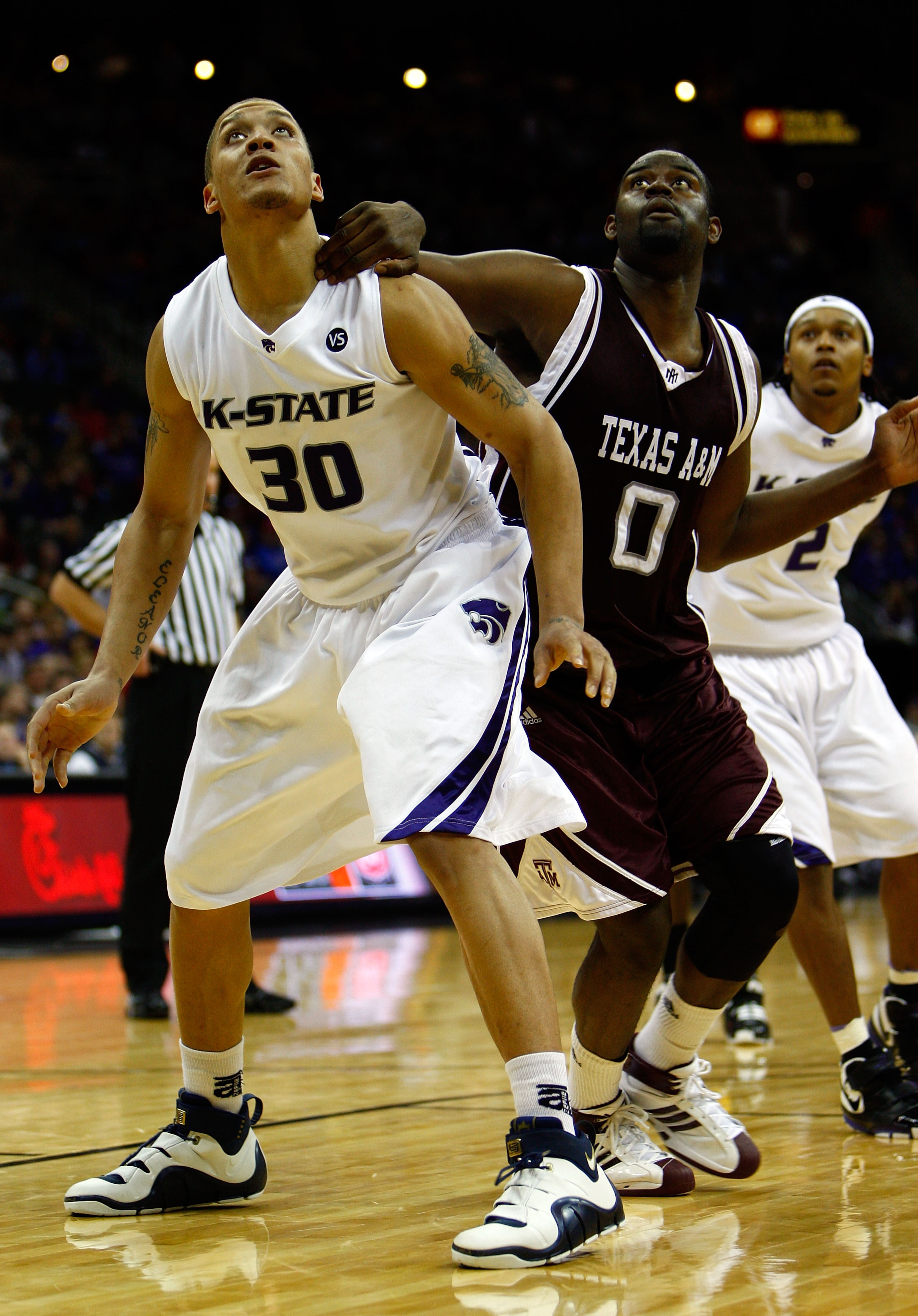 KANSAS CITY, MO - MARCH 14: Michael Beasley #30 of the Kansas State Wildcats boxes out Bryan Davis #0 of the Texas A&M Aggies during the game on day 2 of the Big 12 Men's Basketball Tournament on March 14, 2008 at the Sprint Center in Kansas City, Missou KANSAS CITY, MO - MARCH 14: Michael Beasley #30 of the Kansas State Wildcats boxes out Bryan Davis #0 of the Texas A&M Aggies during the game on day 2 of the Big 12 Men's Basketball Tournament on March 14, 2008 at the Sprint Center in Kansas City, Missou