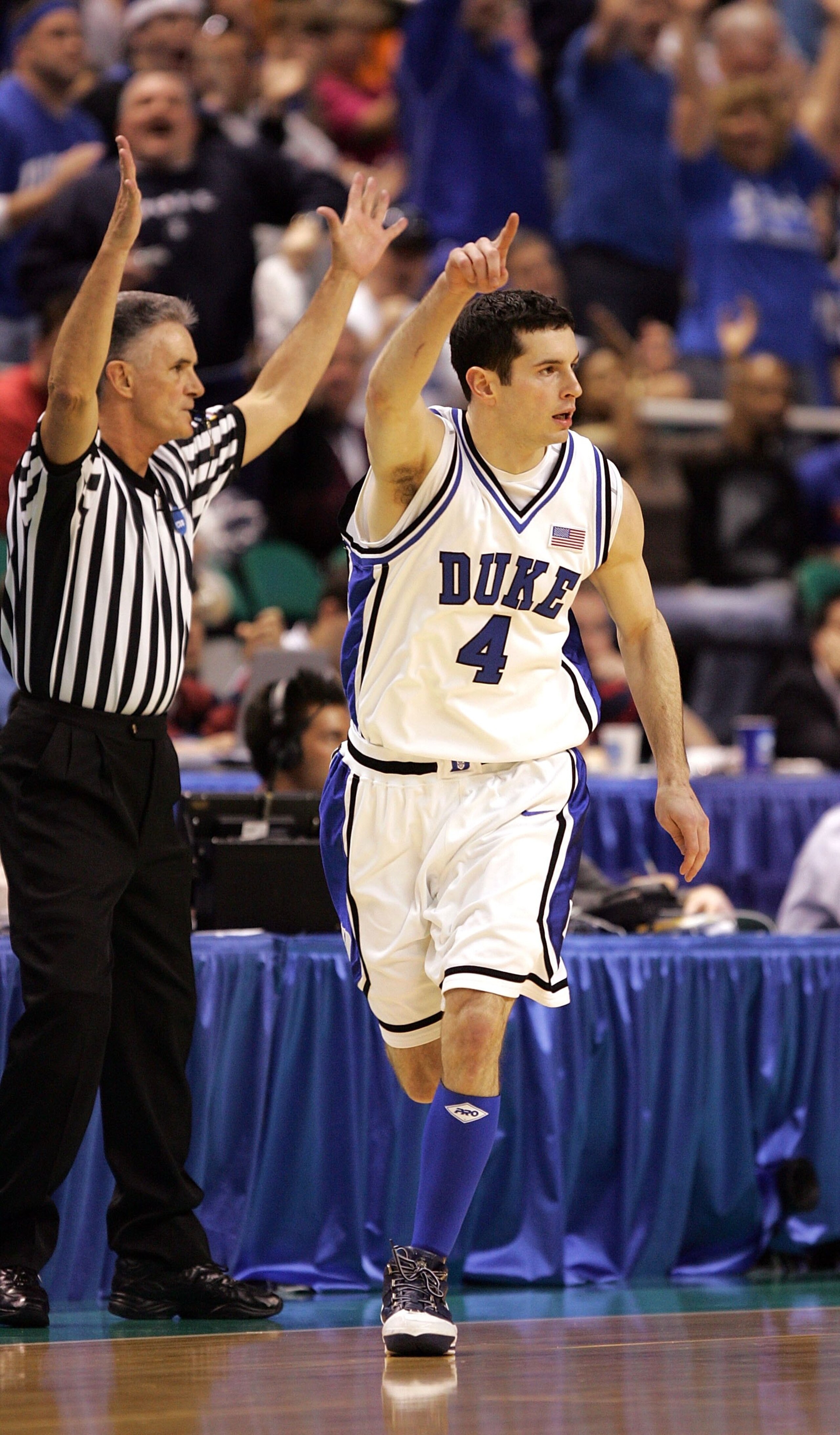 GREENSBORO, NC - MARCH 18:  J.J. Redick #4 of the Duke Blue Devils gestures after making a 3-pointer as he runs back down the floor in the first half against the George Washington Colonials during the Second Round of the 2006 NCAA Men's Basketball Tournam