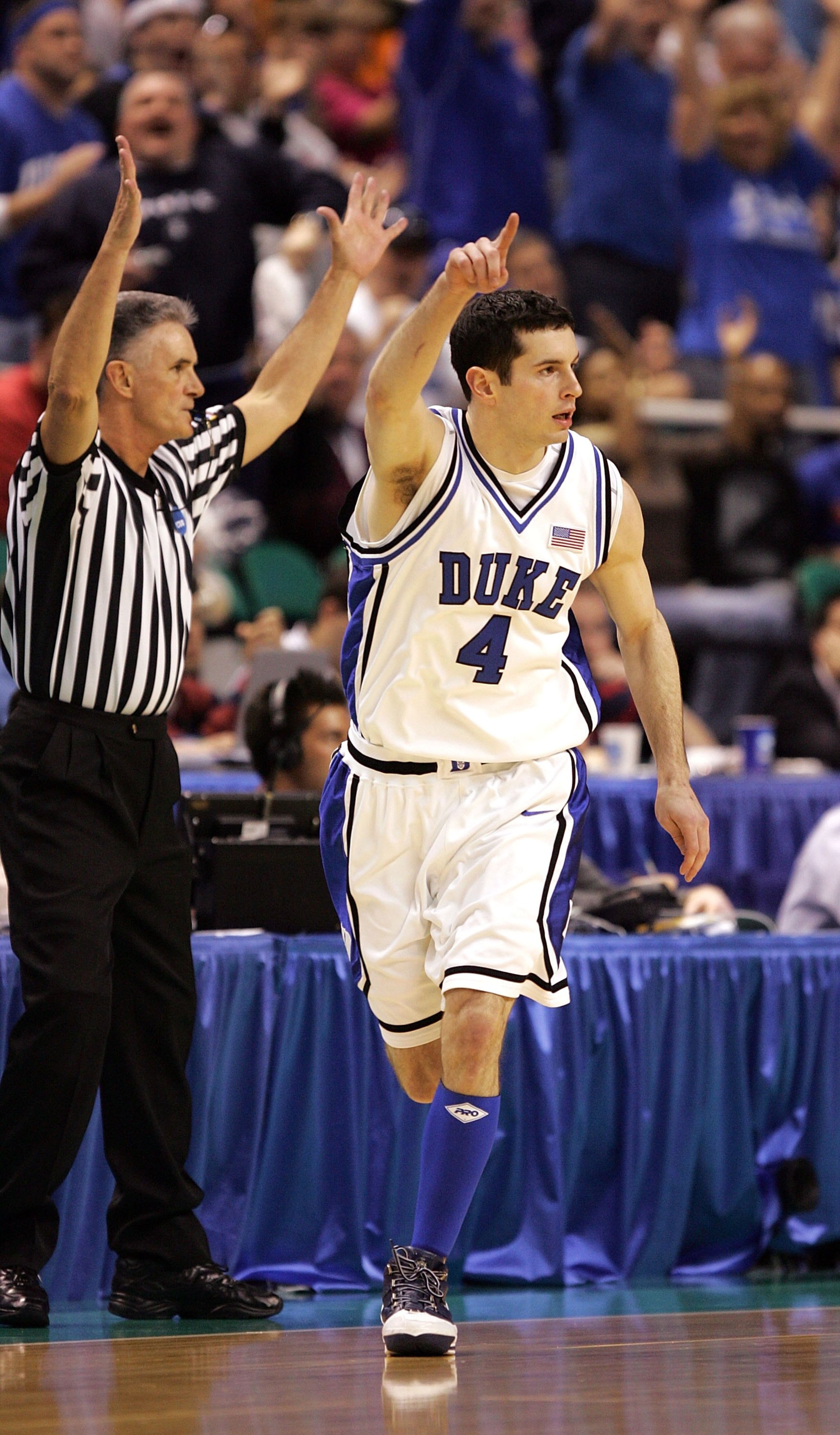 GREENSBORO, NC - MARCH 18: J.J. Redick #4 of the Duke Blue Devils gestures after making a 3-pointer as he runs back down the floor in the first half against the George Washington Colonials during the Second Round of the 2006 NCAA Men's Basketball Tournam GREENSBORO, NC - MARCH 18: J.J. Redick #4 of the Duke Blue Devils gestures after making a 3-pointer as he runs back down the floor in the first half against the George Washington Colonials during the Second Round of the 2006 NCAA Men's Basketball Tournam