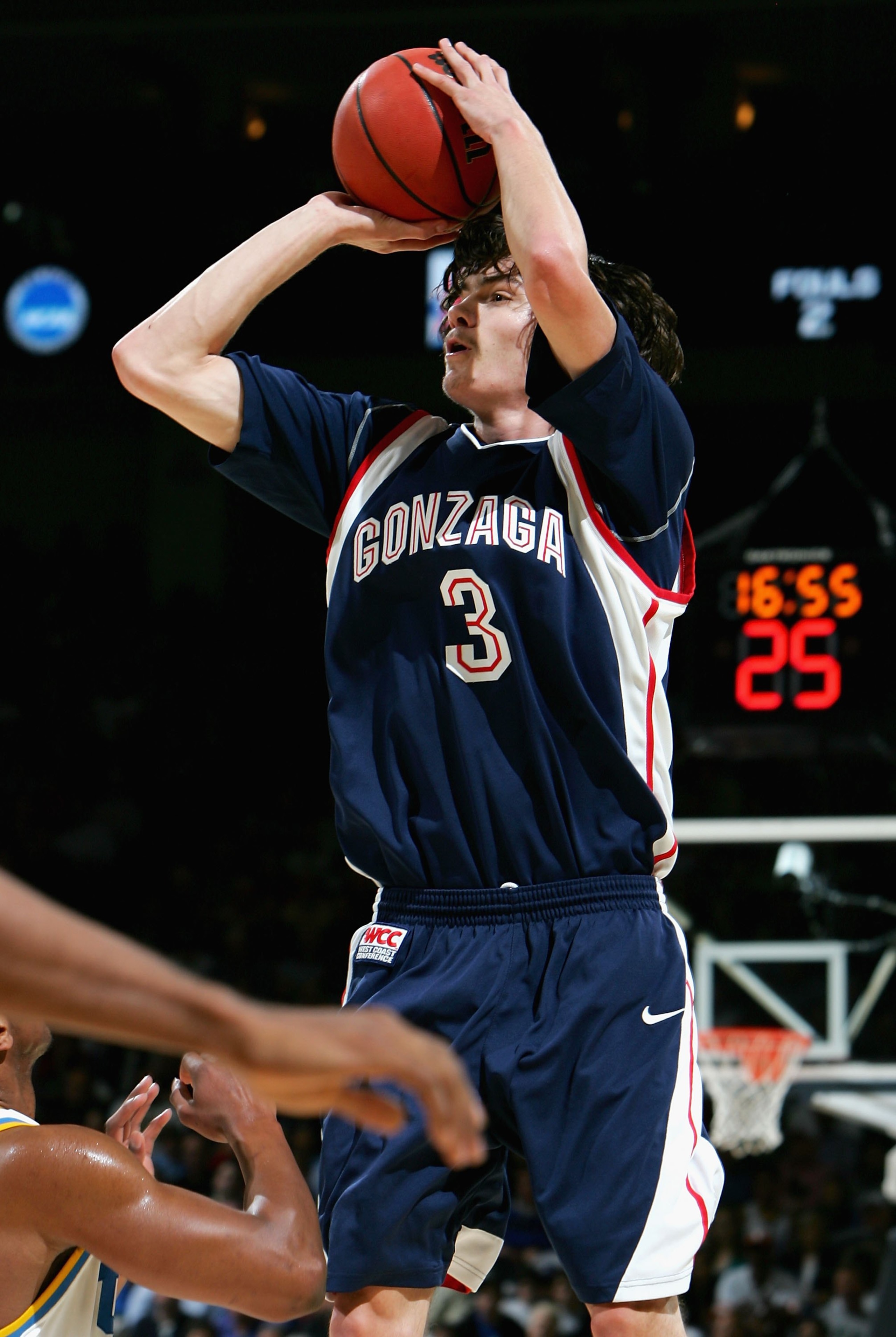 OAKLAND, CA - MARCH 23:  Adam Morrison #3 of the Gonzaga Bulldogs puts up a shot over the UCLA Bruins defense during the third round game of the NCAA Division I Men's Basketball Tournament at the Arena in Oakland on March 23, 2006 in Oakland, California.