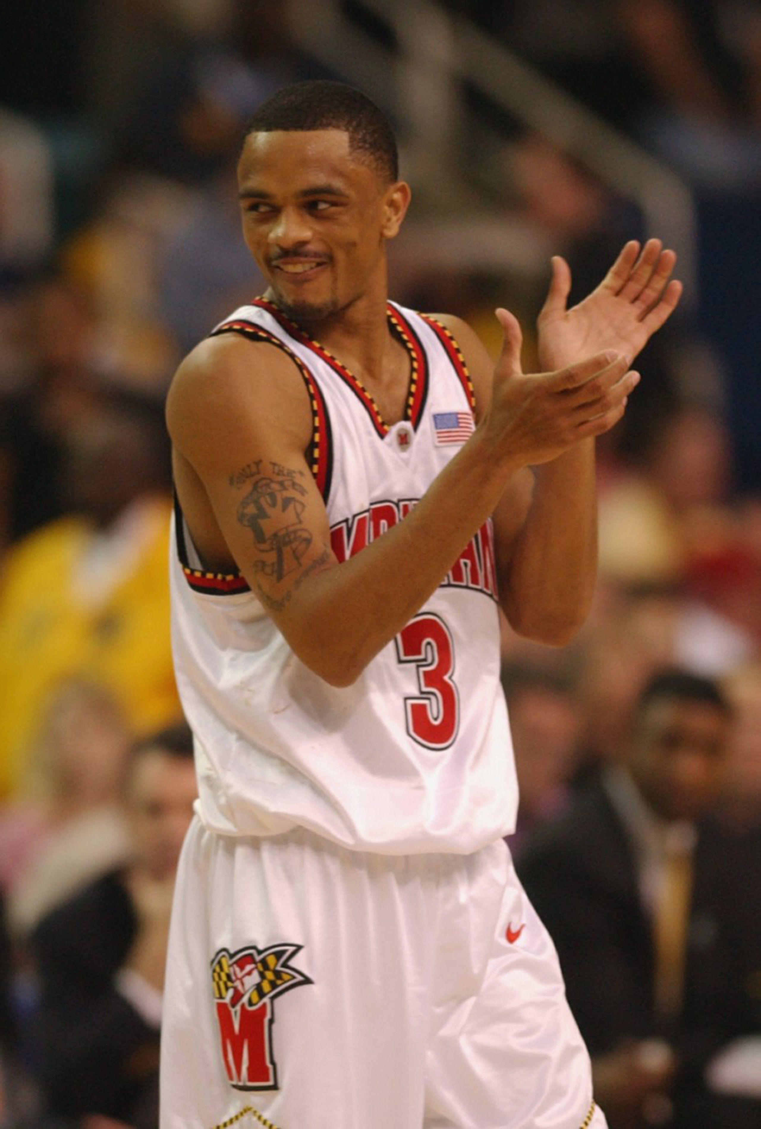 ATLANTA, GA - APRIL 1:  Juan Dixon #3 of the University of Maryland Terrapins celebrates during the men's NCAA National Championship game against the Indiana University Hoosiers at the Georgia Dome in Atlanta, Georgia on April 1, 2002.  Maryland defeated
