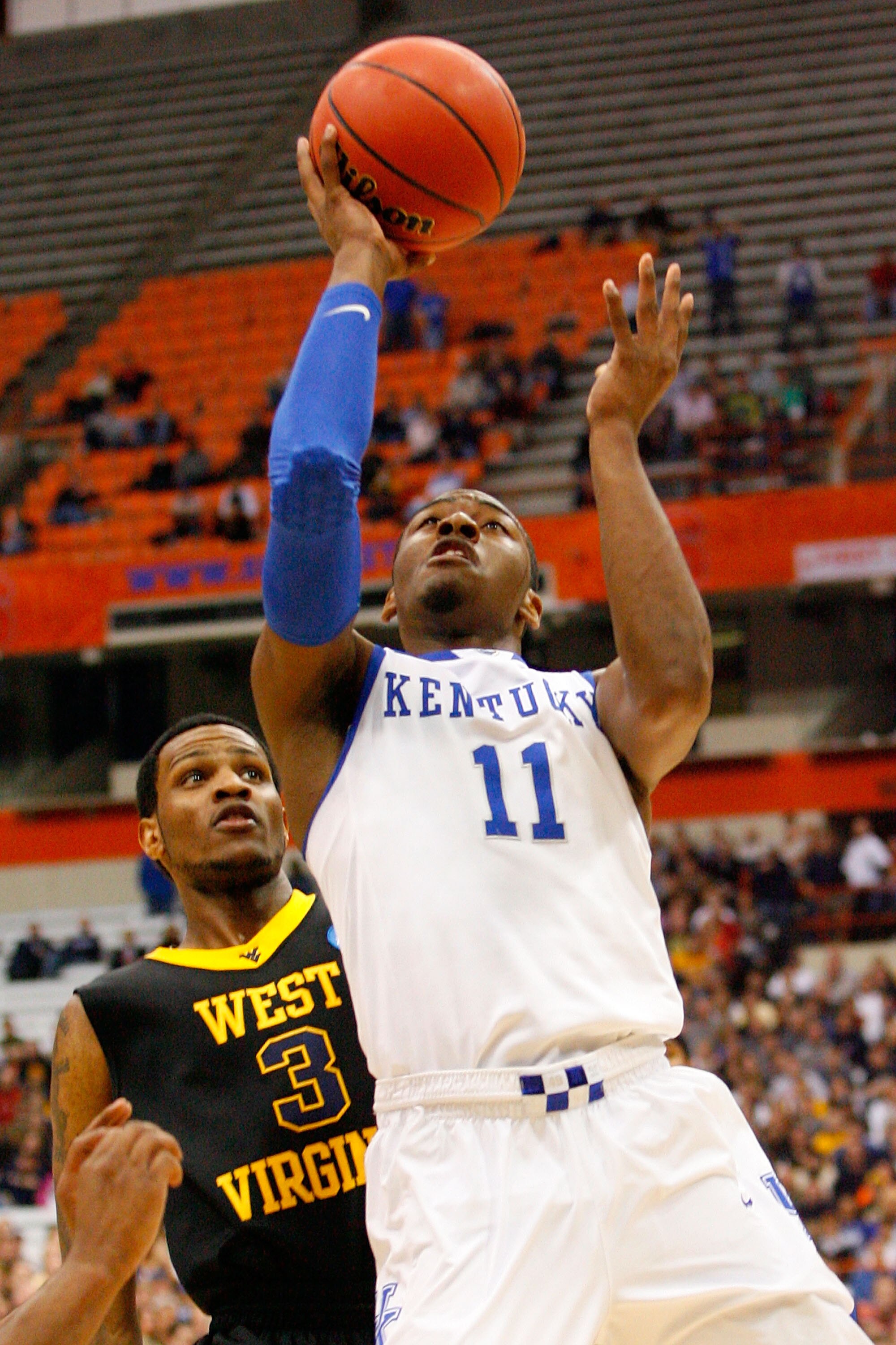SYRACUSE, NY - MARCH 27:  John Wall #11 of the Kentucky Wildcats drives for a shot attempt against the West Virginia Mountaineers during the east regional final of the 2010 NCAA men's basketball tournament at the Carrier Dome on March 27, 2010 in Syracuse