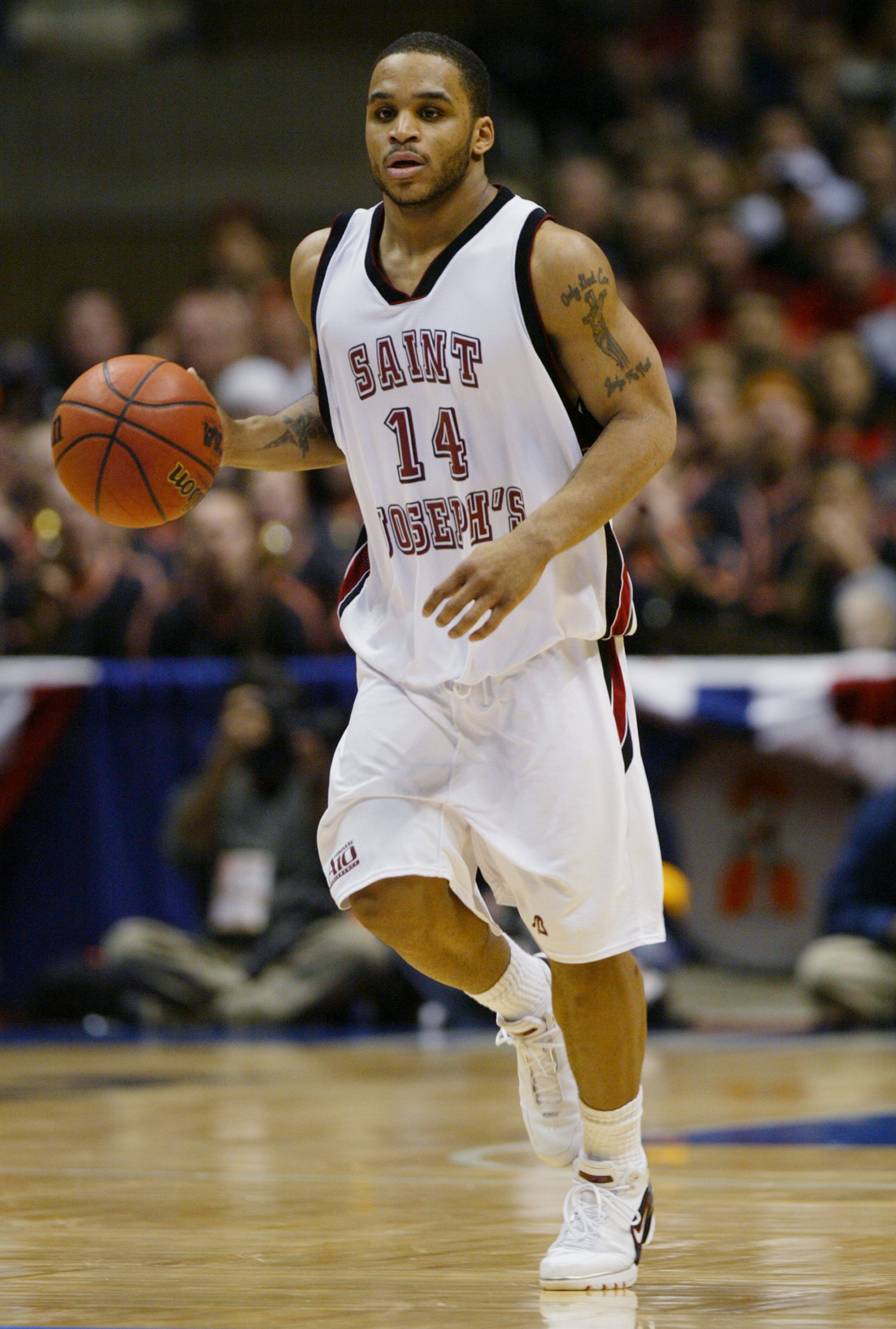 EAST RUTHERFORD, NJ - MARCH 27: Jameer Nelson #14 of the St. Joseph's Hawks moves the ball up court during their Elite 8 game of the NCAA Division I Men's Basketball Tournament against the Oklahoma State Cowboys at Continental Airlines Arena on March 27, EAST RUTHERFORD, NJ - MARCH 27: Jameer Nelson #14 of the St. Joseph's Hawks moves the ball up court during their Elite 8 game of the NCAA Division I Men's Basketball Tournament against the Oklahoma State Cowboys at Continental Airlines Arena on March 27,