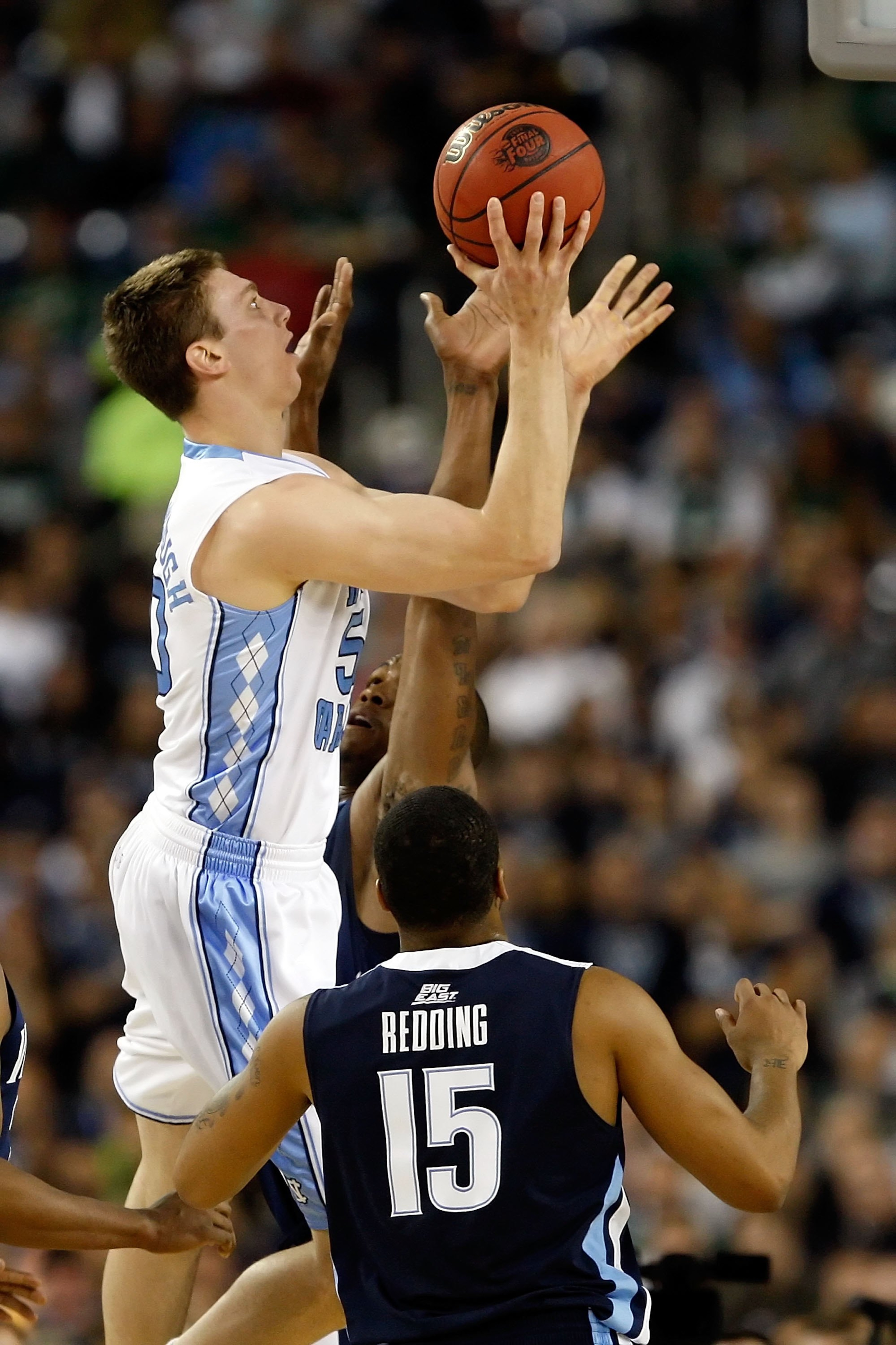 DETROIT - APRIL 04: Tyler Hansbrough #50 of the North Carolina Tar Heels shoots the ball over Reggie Redding #15 and another Villanova Wildcats defender during the National Semifinal game of the NCAA Division I Men's Basketball Championship at Ford Field DETROIT - APRIL 04: Tyler Hansbrough #50 of the North Carolina Tar Heels shoots the ball over Reggie Redding #15 and another Villanova Wildcats defender during the National Semifinal game of the NCAA Division I Men's Basketball Championship at Ford Field