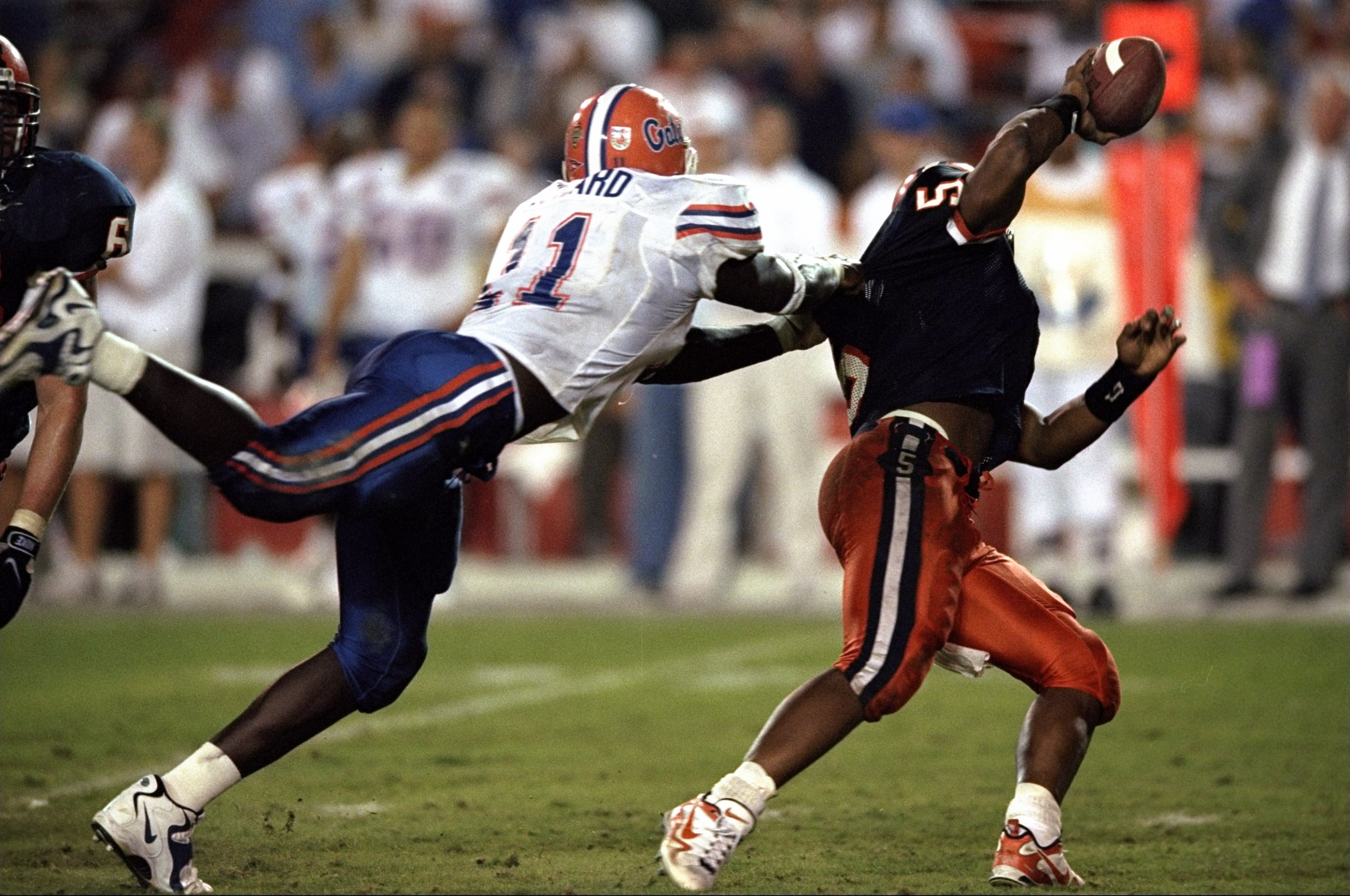 1 Jan 1999: Donovan McNabb #5 of the Syracuse Orangeman is sacked by Thaddeus Bullard #11 of the Florida Gators during the Orange Bowl at the Orange Bowl in Miami, Florida. Florida defeated Syracuse 31-10. Mandatory Credit: Harry How /Allsport 1 Jan 1999: Donovan McNabb #5 of the Syracuse Orangeman is sacked by Thaddeus Bullard #11 of the Florida Gators during the Orange Bowl at the Orange Bowl in Miami, Florida. Florida defeated Syracuse 31-10. Mandatory Credit: Harry How /Allsport