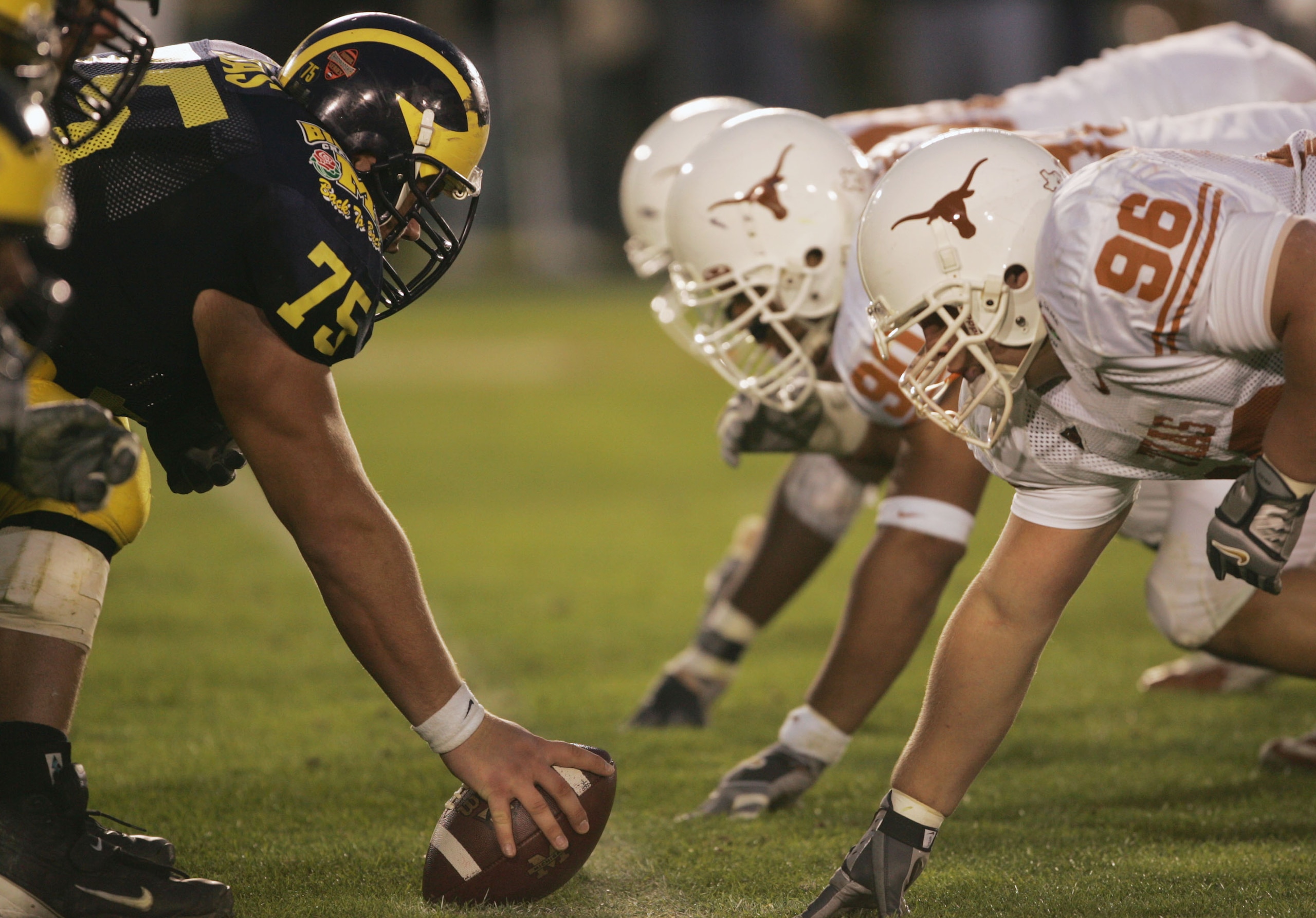 PASADENA, CA - JANUARY 1: In the trenches as the Texas Longhorns take on the Michigan Wolverines in the 91st Rose Bowl Game at the Rose Bowl on January 1, 2005 in Pasadena, California. Texas defeated Michigan 38-37. (Photo by Stephen Dunn/Getty Images) PASADENA, CA - JANUARY 1: In the trenches as the Texas Longhorns take on the Michigan Wolverines in the 91st Rose Bowl Game at the Rose Bowl on January 1, 2005 in Pasadena, California. Texas defeated Michigan 38-37. (Photo by Stephen Dunn/Getty Images)