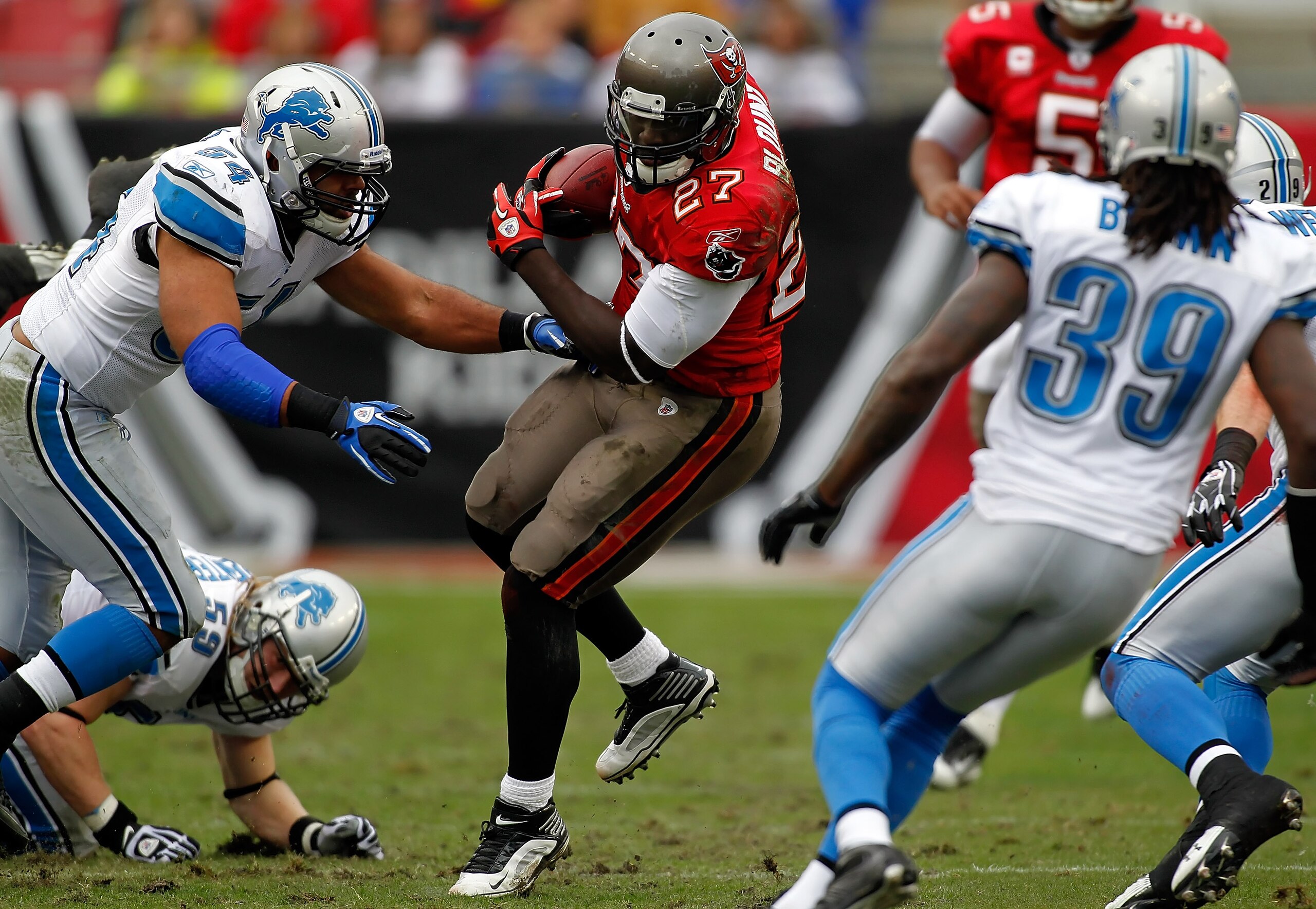 TAMPA, FL - DECEMBER 19: Running back LeGarrette Blount #27 of the Tampa Bay Buccaneers runs the ball against the Detroit Lions during the game at Raymond James Stadium on December 19, 2010 in Tampa, Florida. (Photo by J. Meric/Getty Images) TAMPA, FL - DECEMBER 19: Running back LeGarrette Blount #27 of the Tampa Bay Buccaneers runs the ball against the Detroit Lions during the game at Raymond James Stadium on December 19, 2010 in Tampa, Florida. (Photo by J. Meric/Getty Images)
