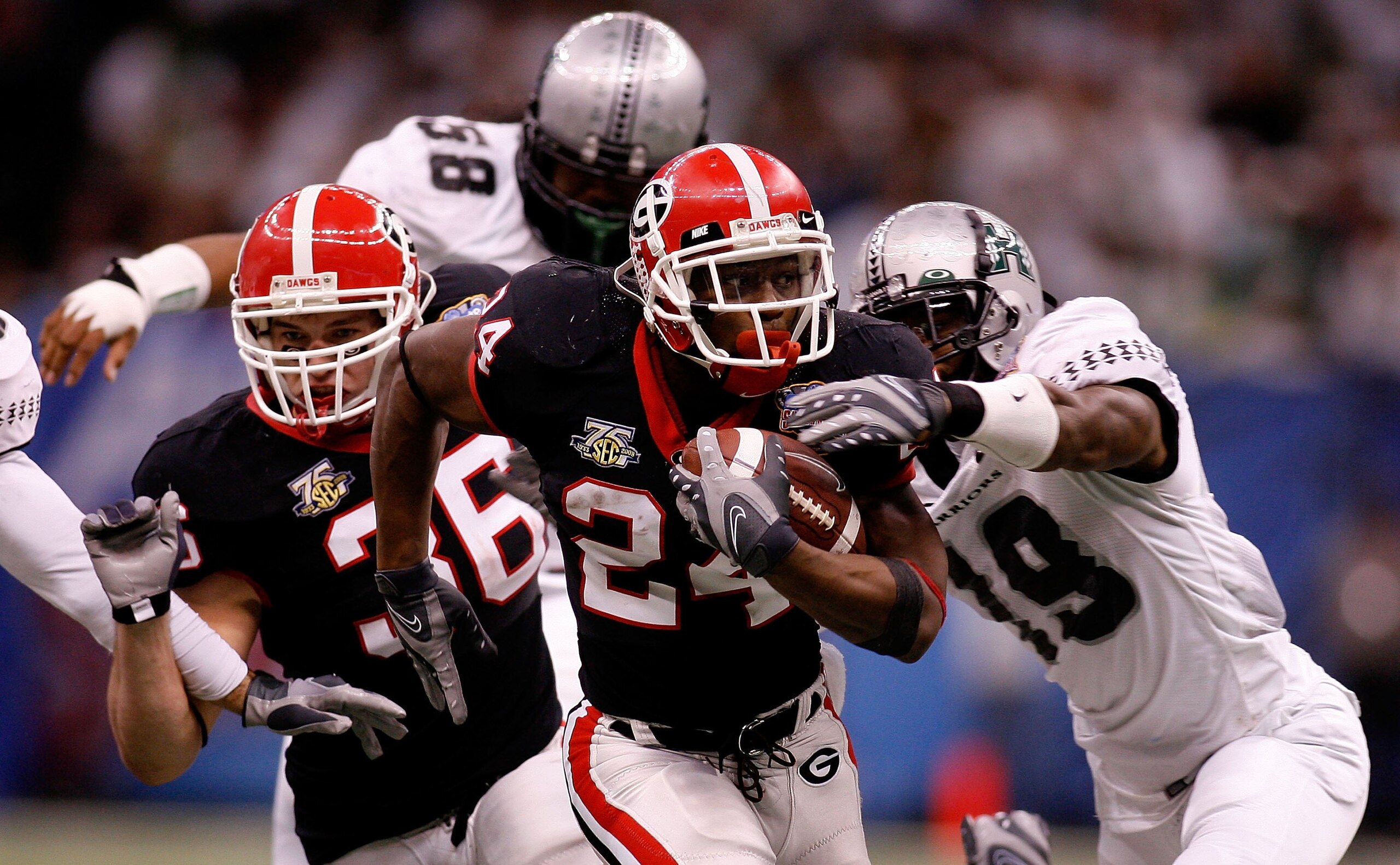 NEW ORLEANS - JANUARY 01: Knowshon Moreno #24 of the Georgia Bulldogs runs the ball against Erik RObinson #19 of the Hawai'i Warriors during the Allstate Sugar Bowl at the Louisiana Superdome on January 1, 2008 in New Orleans, Louisiana. Georgia won 41-1 NEW ORLEANS - JANUARY 01: Knowshon Moreno #24 of the Georgia Bulldogs runs the ball against Erik RObinson #19 of the Hawai'i Warriors during the Allstate Sugar Bowl at the Louisiana Superdome on January 1, 2008 in New Orleans, Louisiana. Georgia won 41-1
