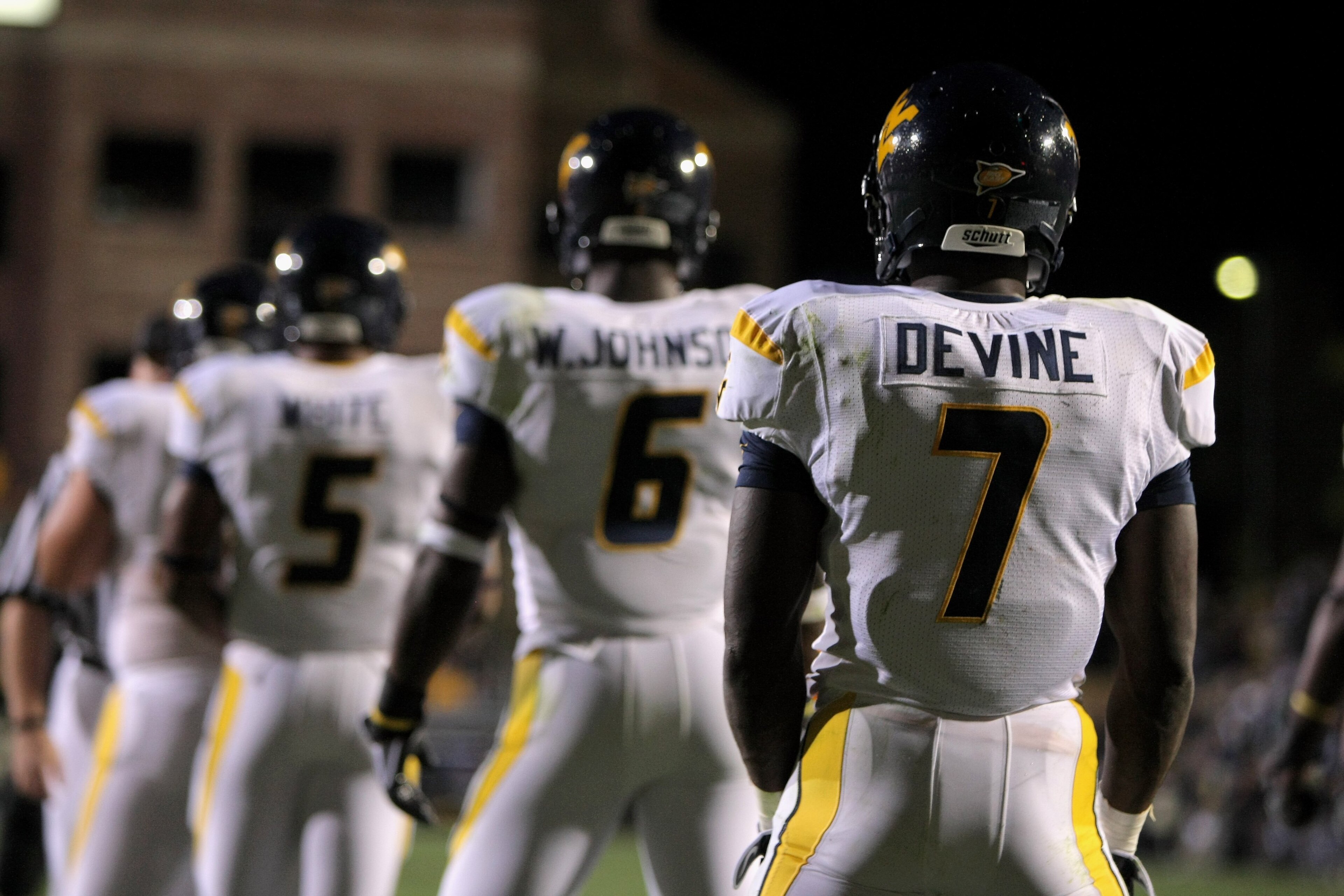 BOULDER, CO - SEPTEMBER 18:  Quarterback Pat White #5 of the West Virginia Mountaineers along with Will Johnson #6 and Noel Devine #7 line up in the back field against the Colorado Buffaloes at Folsom Field on September 18, 2008 in Boulder, Colorado. Colo