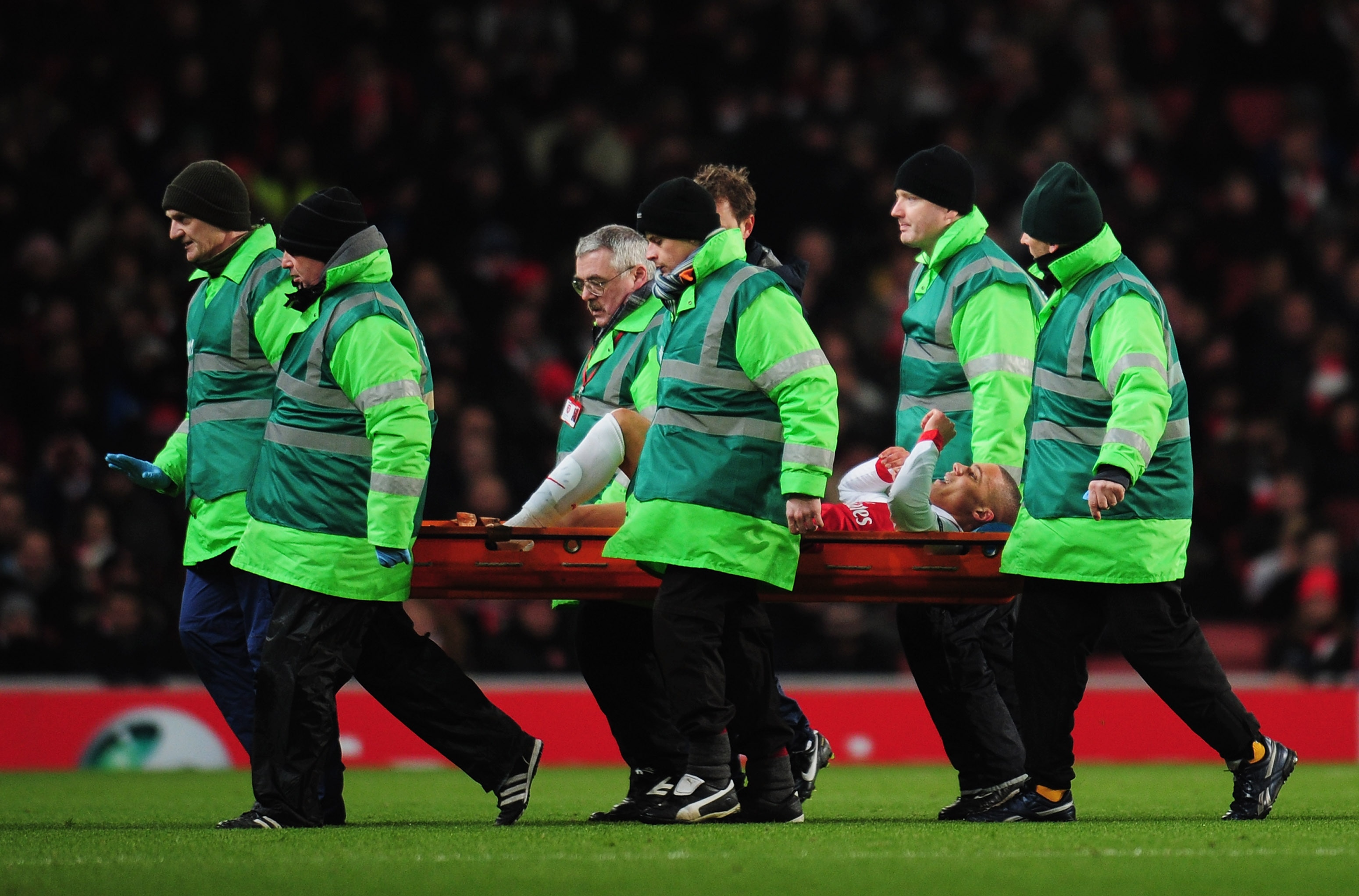 LONDON, ENGLAND - DECEMBER 08:  An injured Kieran Gibbs of Arsenal is stretchered off during the UEFA Champions League Group H match between Arsenal and FK Partizan Belgrade at the Emirates Stadium on December 8, 2010 in London, England. Kieran Gibbs retu