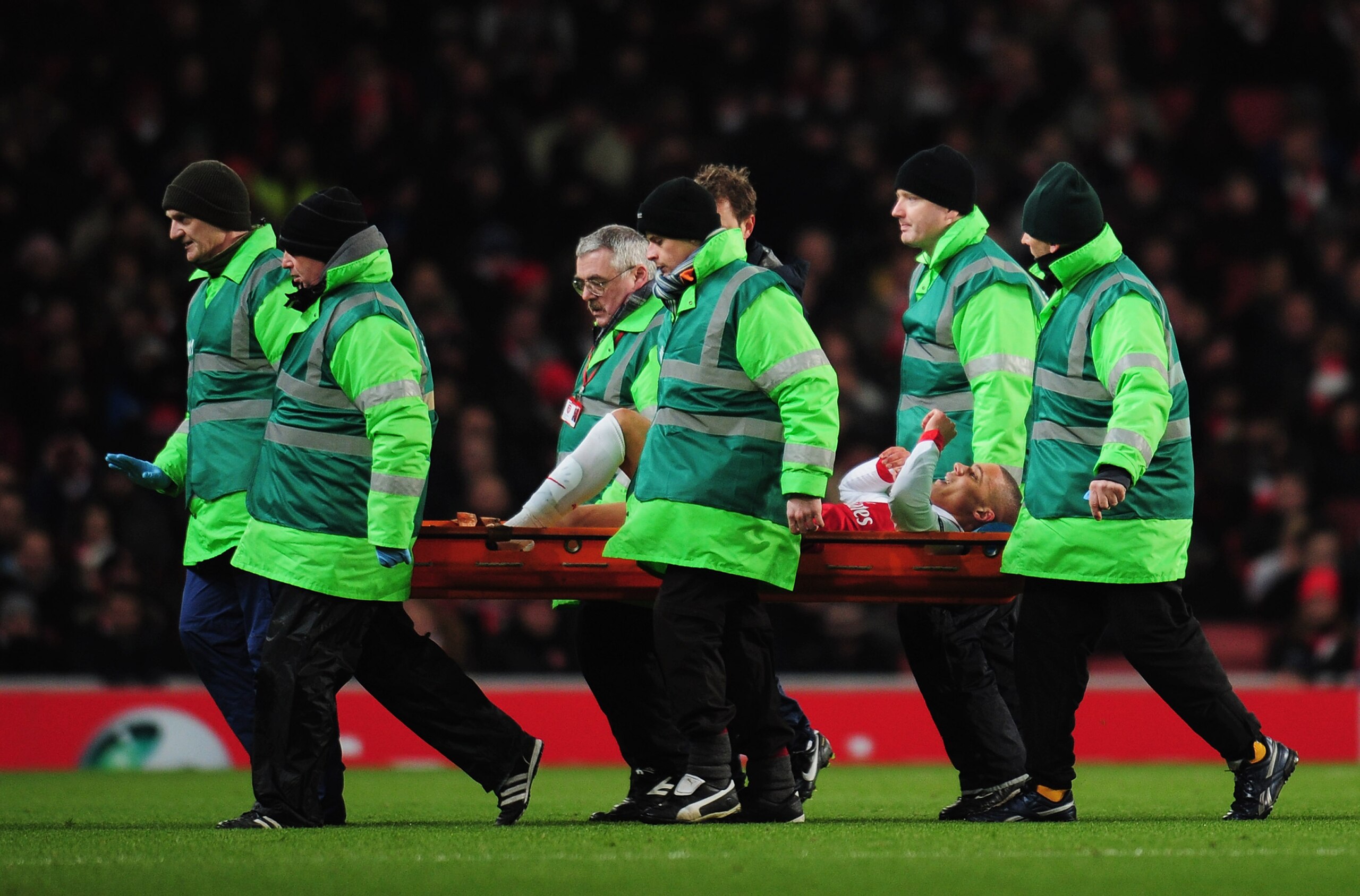 LONDON, ENGLAND - DECEMBER 08:  An injured Kieran Gibbs of Arsenal is stretchered off during the UEFA Champions League Group H match between Arsenal and FK Partizan Belgrade at the Emirates Stadium on December 8, 2010 in London, England. Kieran Gibbs retu