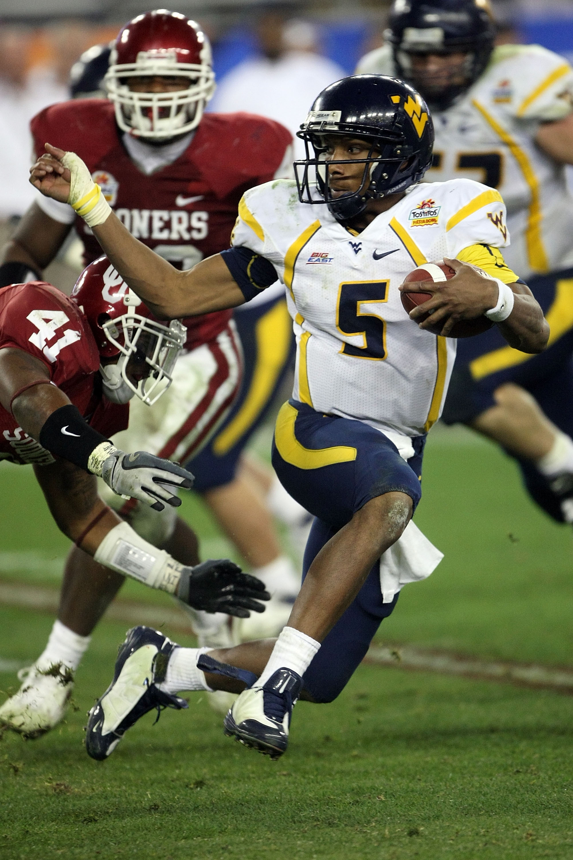GLENDALE, AZ - JANUARY 02:  Quarterback Patrick White #5 of the West Virginia Mountaineers runs the ball against the Oklahoma Sooners in the second half at the Tostito's Fiesta Bowl at University of Phoenix Stadium January 2, 2008 in Glendale, Arizona.  (