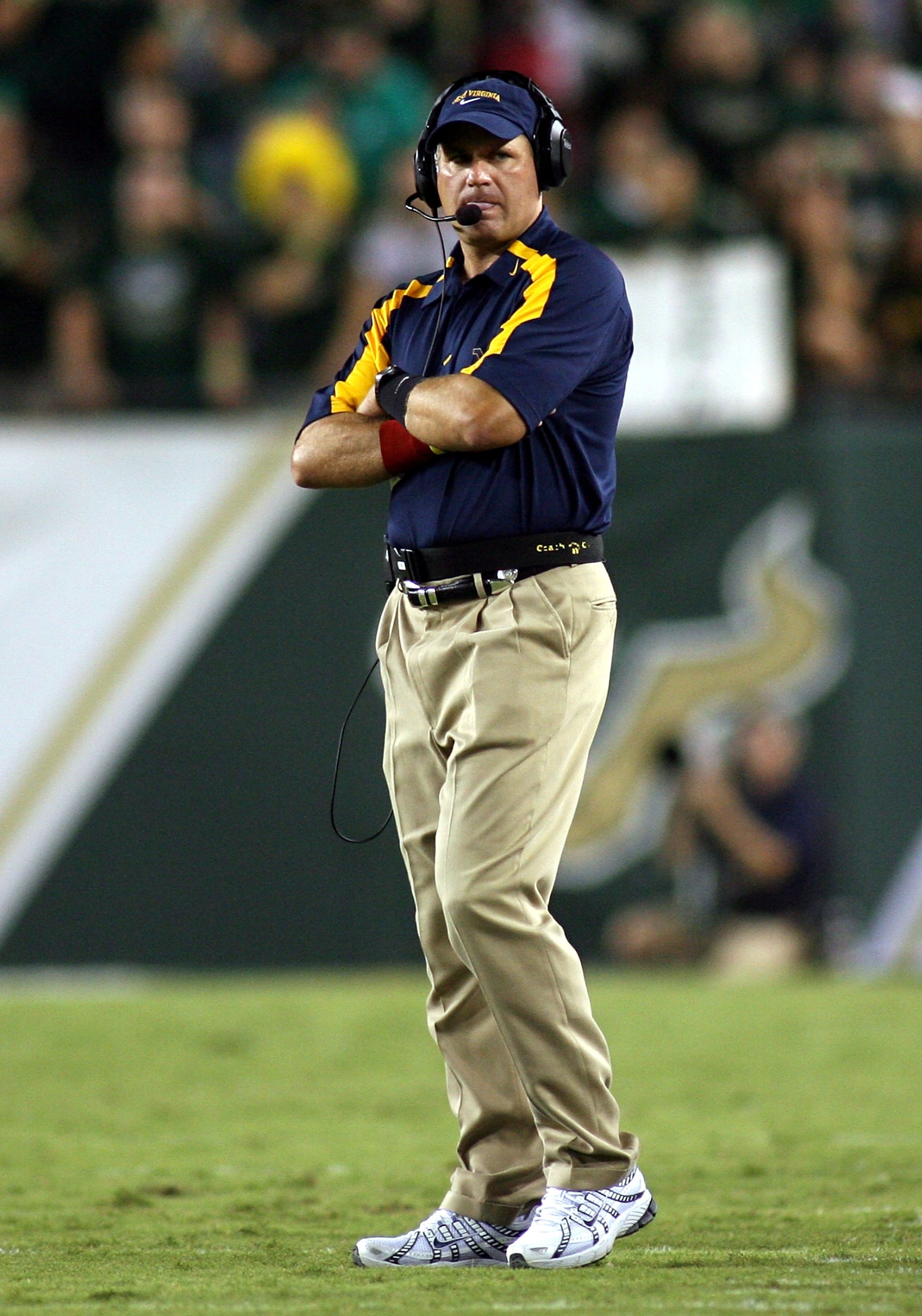 TAMPA, FL - SEPTEMBER 28:  Coach Rich Rodriguez of the West Virginia Mountaineers walks the sidelines during his teams 21-13 loss against the University of South Florida Bulls at Raymond James Stadium September 28, 2007 in Tampa Florida.  (Photo by Marc S