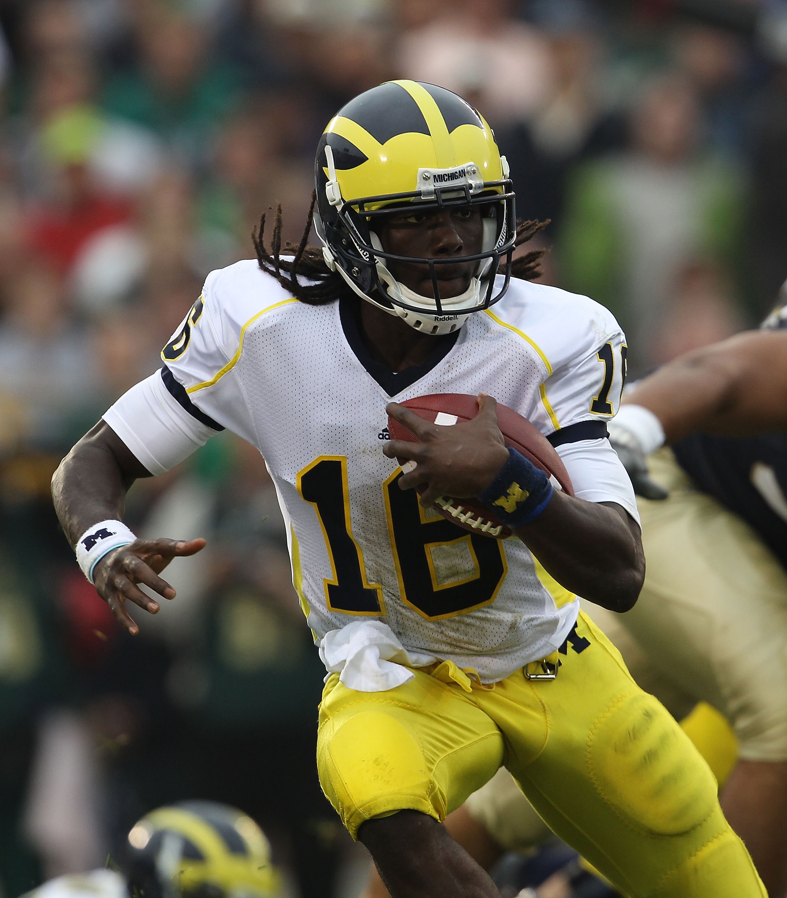 SOUTH BEND, IN - SEPTEMBER 11: Denard Robinson #16 of the Michigan Wolverines takes off on an 87 yard touchdown run against the Notre Dame Fighting Irish at Notre Dame Stadium on September 11, 2010 in South Bend, Indiana. Michigan defeated Notre Dame 28-2