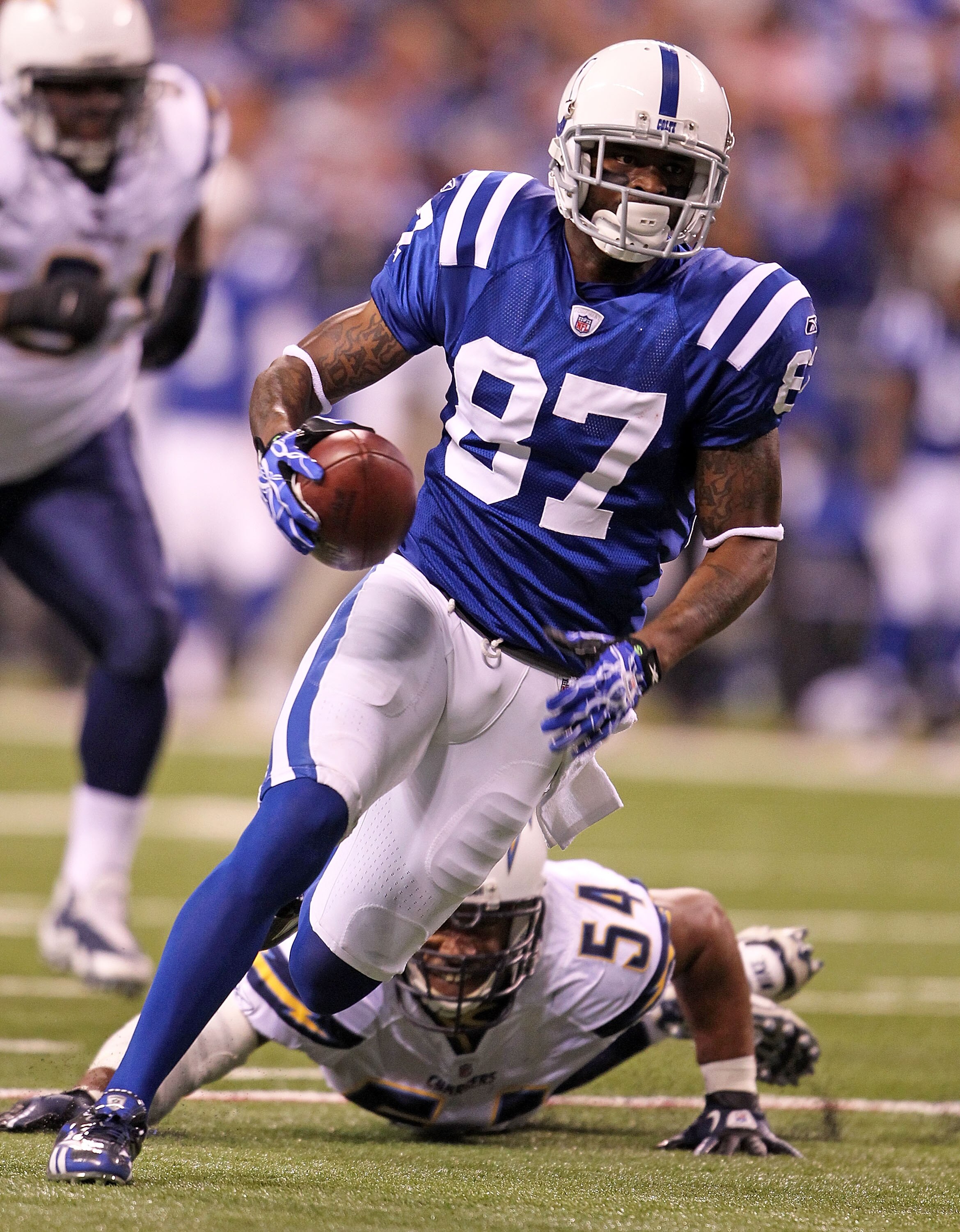 INDIANAPOLIS - NOVEMBER 28: Reggie Wayne #87 of the Indianapolis Colts runs with the ball during the NFL game against the San Diego Chargers at Lucas Oil Stadium on November 28, 2010 in Indianapolis, Indiana.  (Photo by Andy Lyons/Getty Images)