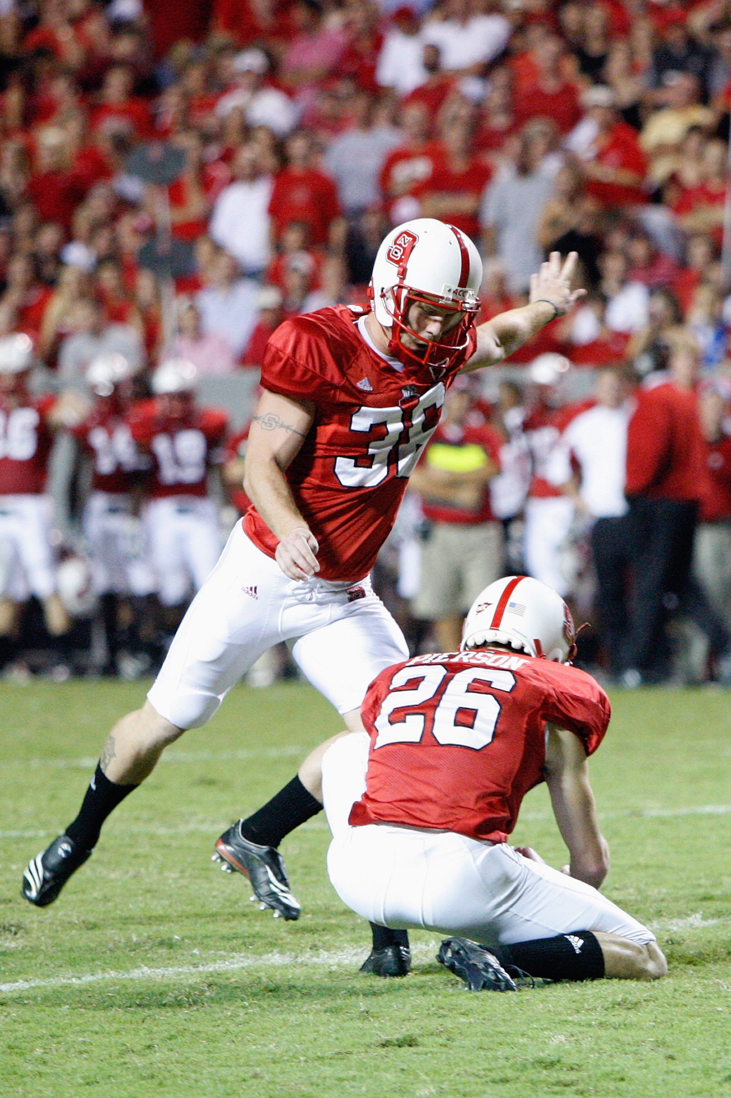 RALEIGH, NC - OCTOBER 16:  Josh Czajkowski  #36 of the North Carolina State Wolfpack kicks during the game against the Florida State Seminoles at Carter-Finley Stadium on October 16, 2008 in Raleigh, North Carolina.  (Photo by Kevin C. Cox/Getty Images)