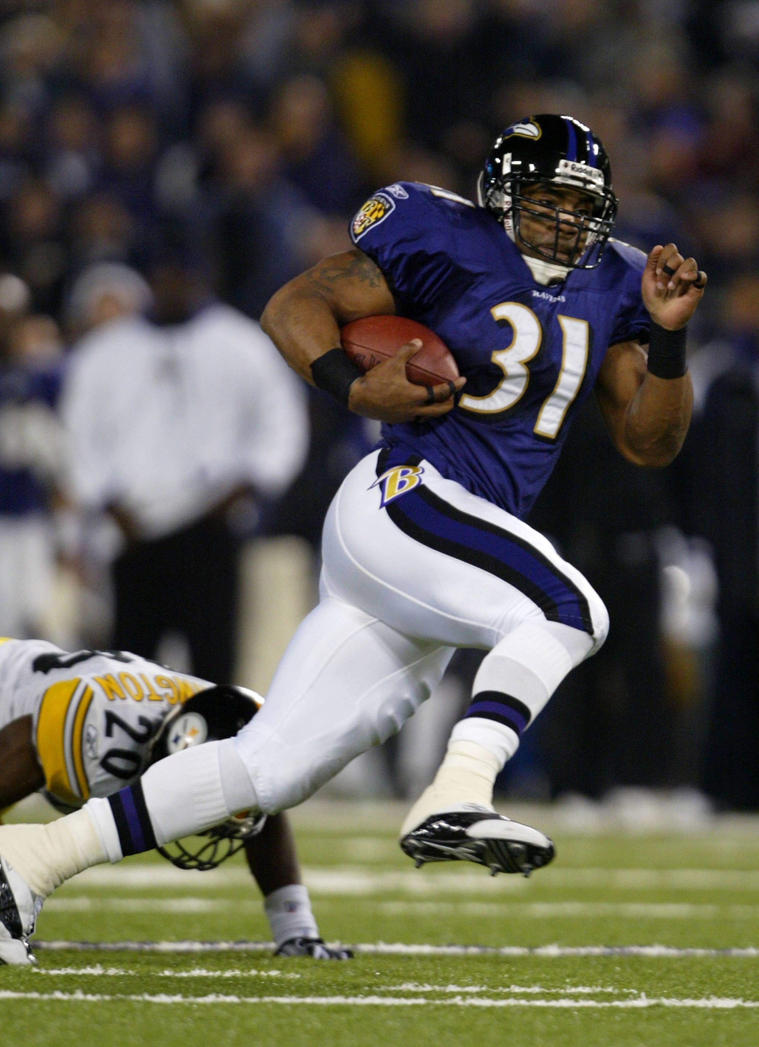 BALTIMORE - DECEMBER 28: Jamal Lewis #31 of the Baltimore Ravens leaves Dewayne Washington #20 of the Pittsburgh Steelers in his wake as he goes 26 yards for a first quarter touchdwon to give the Ravens a 7-0 lead over the Steelers during NFL action on D BALTIMORE - DECEMBER 28: Jamal Lewis #31 of the Baltimore Ravens leaves Dewayne Washington #20 of the Pittsburgh Steelers in his wake as he goes 26 yards for a first quarter touchdwon to give the Ravens a 7-0 lead over the Steelers during NFL action on D