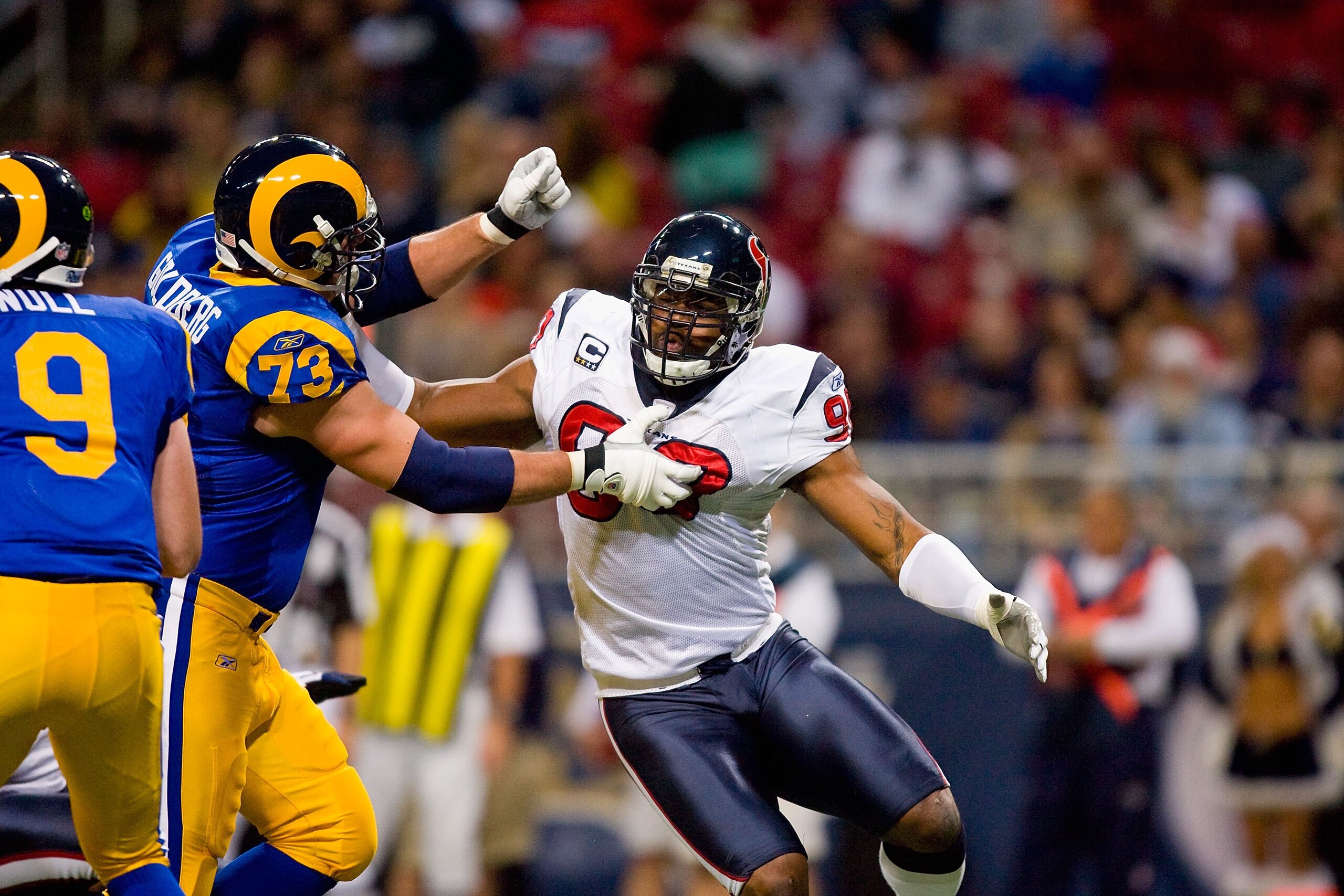 ST. LOUIS - DECEMBER 20: Mario Williams #90 of the Houston Texans rushes against Adam Goldberg #73 of the St. Louis Rams at Edward Jones Dome on December 20, 2009 in St. Louis, Missouri. (Photo by Dilip Vishwanat/Getty Images) ST. LOUIS - DECEMBER 20: Mario Williams #90 of the Houston Texans rushes against Adam Goldberg #73 of the St. Louis Rams at Edward Jones Dome on December 20, 2009 in St. Louis, Missouri. (Photo by Dilip Vishwanat/Getty Images)