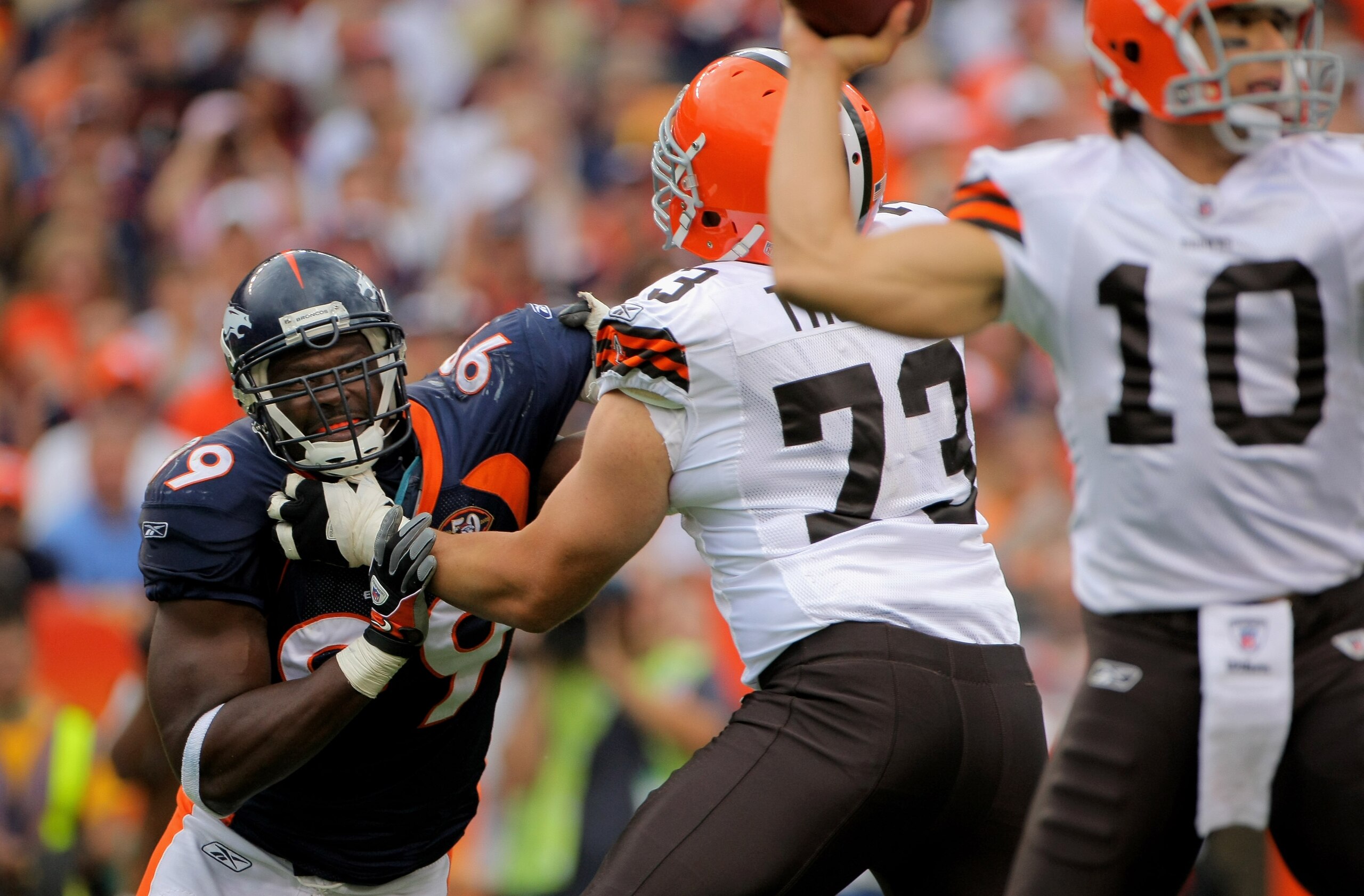 DENVER - SEPTEMBER 20: Defensive end Vonnie Holliday #99 of the Denver Broncos battles the block of offensive lineman Joe Thomas #73 of the Cleveland Browns as he rushes quarterback Brady Quinn #10 during NFL action at Invesco Field at Mile High on Septe DENVER - SEPTEMBER 20: Defensive end Vonnie Holliday #99 of the Denver Broncos battles the block of offensive lineman Joe Thomas #73 of the Cleveland Browns as he rushes quarterback Brady Quinn #10 during NFL action at Invesco Field at Mile High on Septe