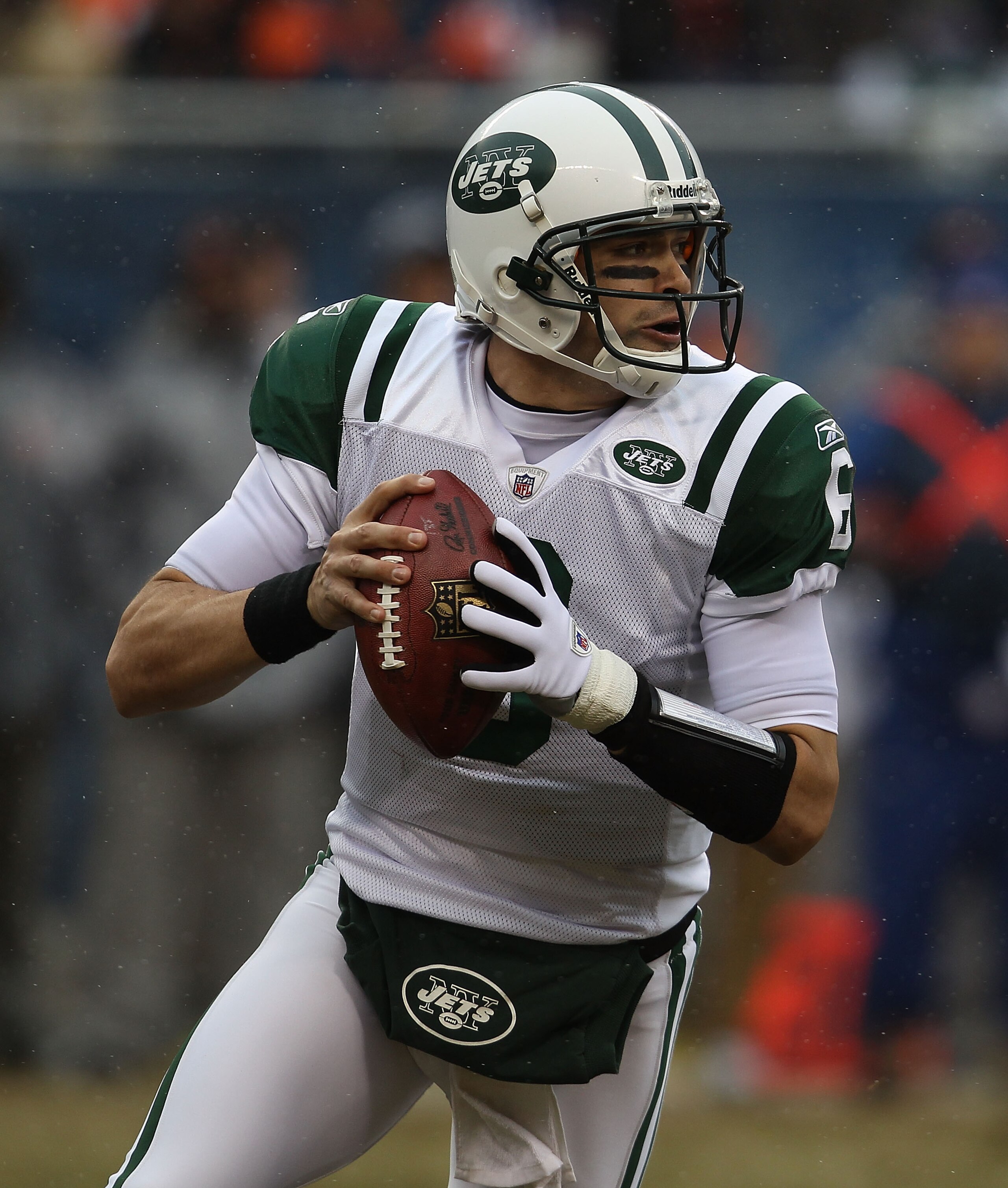 CHICAGO, IL - DECEMBER 26: Mark Sanchez #6 of the New York Jets rolls out to look for a receiver against the Chicago Bears rush at Soldier Field on December 26, 2010 in Chicago, Illinois. The Bears defeated the Jets 38-34. (Photo by Jonathan Daniel/Getty