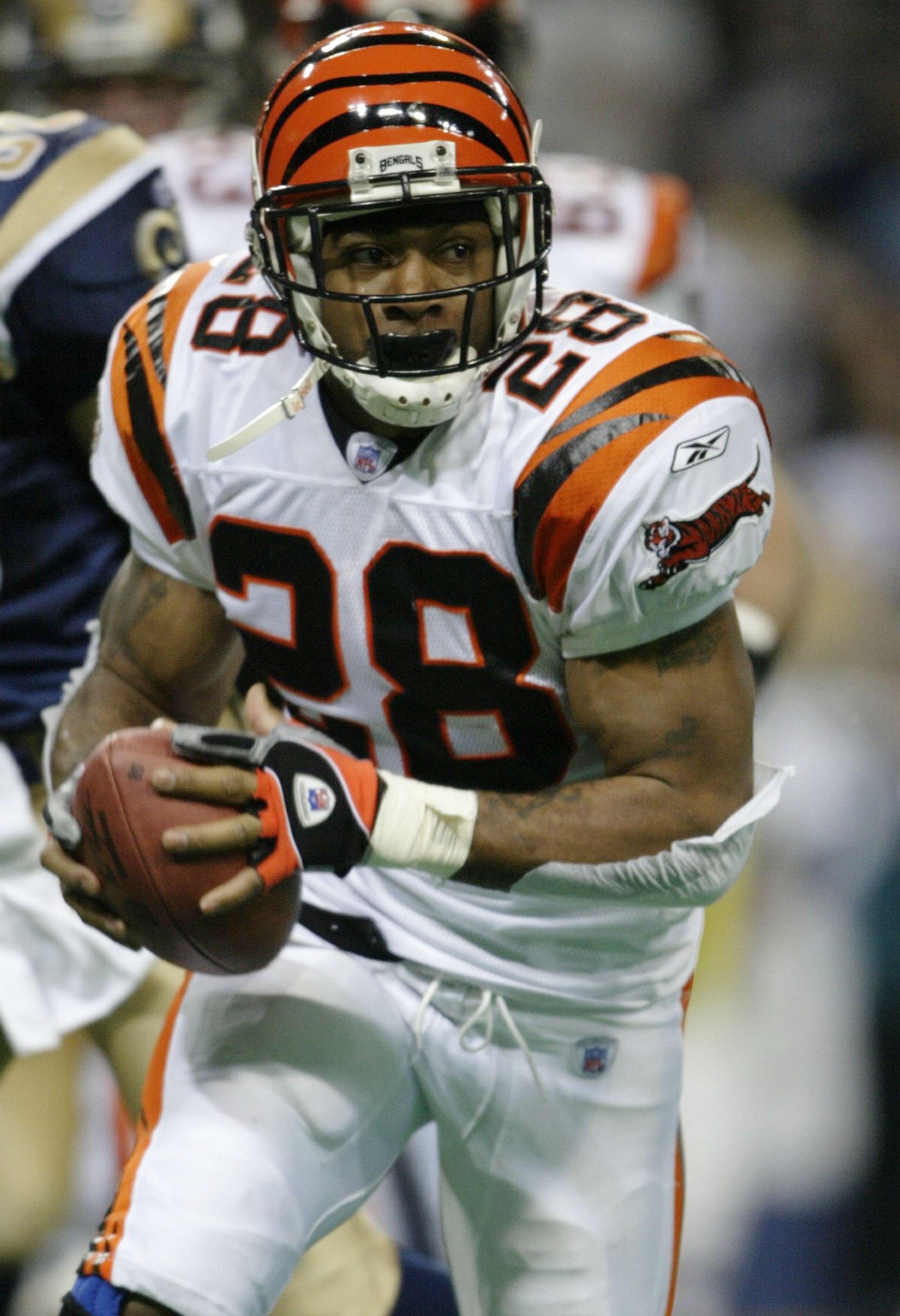 ST. LOUIS - DECEMBER 21: Corey Dillon #28 of the Cincinnati Bengals carries the ball in the first half against the St. Louis Rams December 21, 2003 at the Edward Jones Dome in St. Louis, Missouri. (Photo by Elsa/Getty Images) ST. LOUIS - DECEMBER 21: Corey Dillon #28 of the Cincinnati Bengals carries the ball in the first half against the St. Louis Rams December 21, 2003 at the Edward Jones Dome in St. Louis, Missouri. (Photo by Elsa/Getty Images)