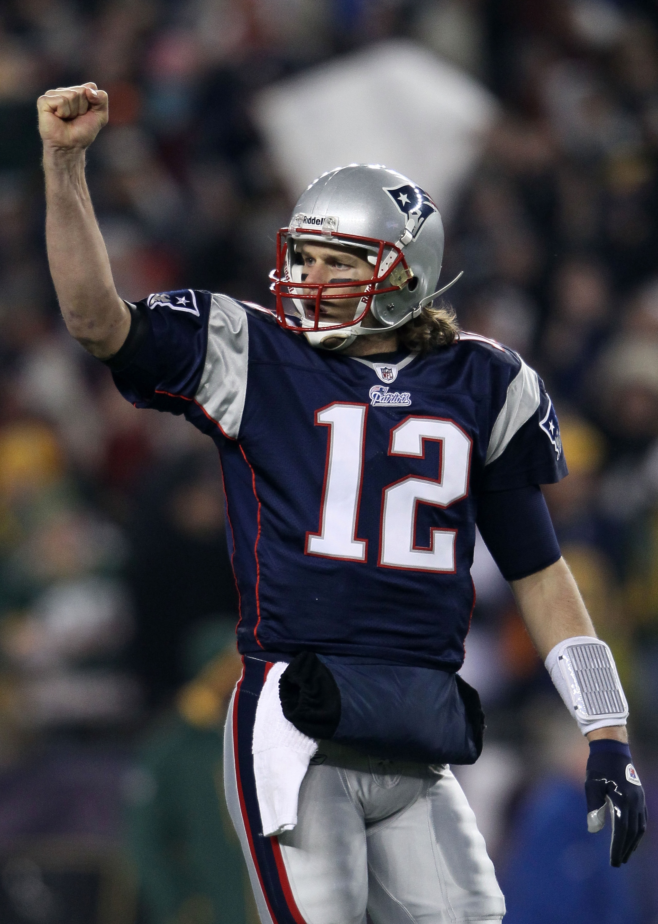 FOXBORO, MA - DECEMBER 19: Quarterback Tom Brady #12 of the New England Patriots celebrates a touchdown scored by running back BenJarvus Green-Ellis #42 (not pictured) against the Green Bay Packers in the first quarter of the game at Gillette Stadium on FOXBORO, MA - DECEMBER 19: Quarterback Tom Brady #12 of the New England Patriots celebrates a touchdown scored by running back BenJarvus Green-Ellis #42 (not pictured) against the Green Bay Packers in the first quarter of the game at Gillette Stadium on
