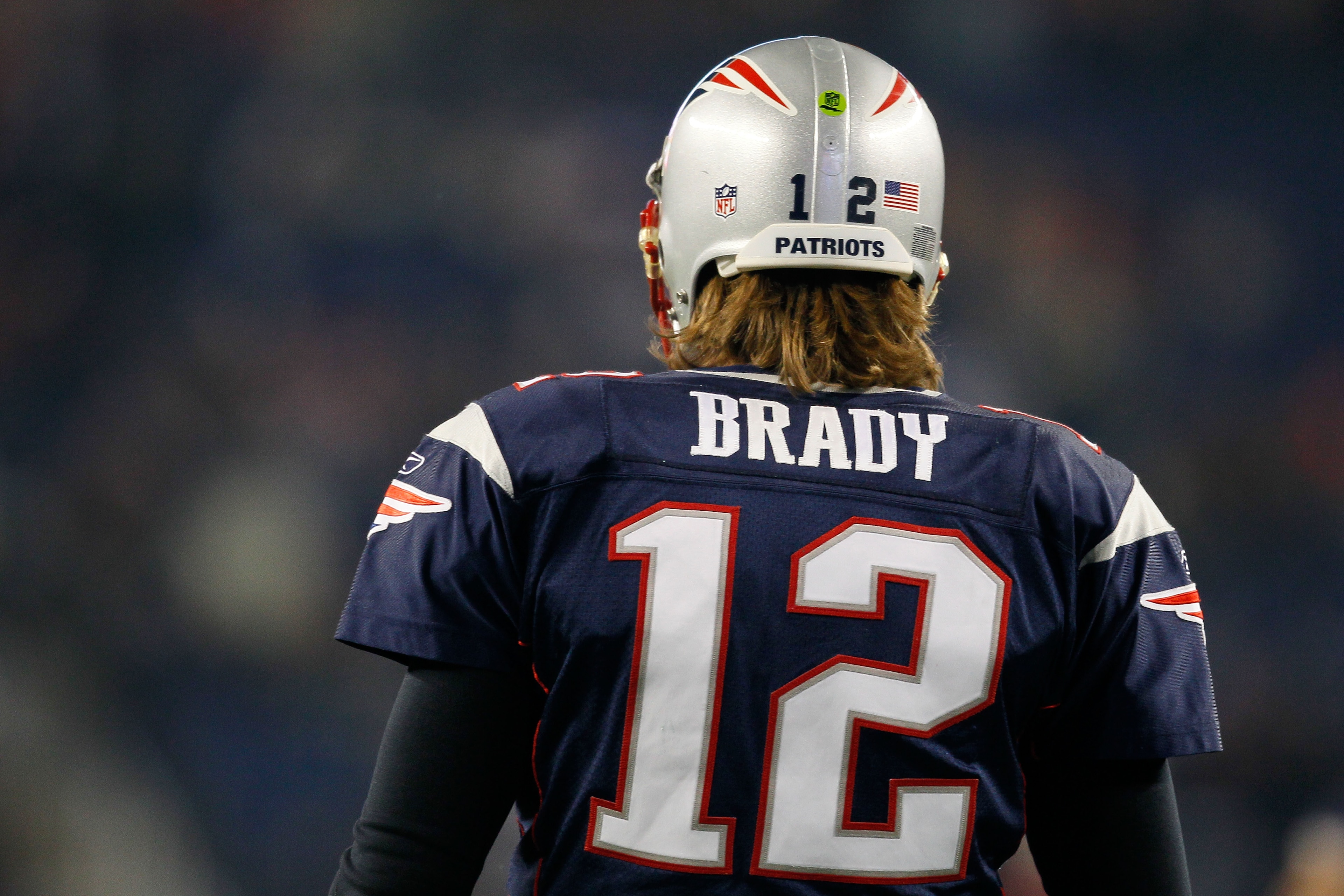 FOXBORO, MA - DECEMBER 19:  Quarterback Tom Brady #12 of the New England Patriots looks on during warm-ups before playing against the Green Bay Packers at Gillette Stadium on December 19, 2010 in Foxboro, Massachusetts.  (Photo by Jim Rogash/Getty Images)