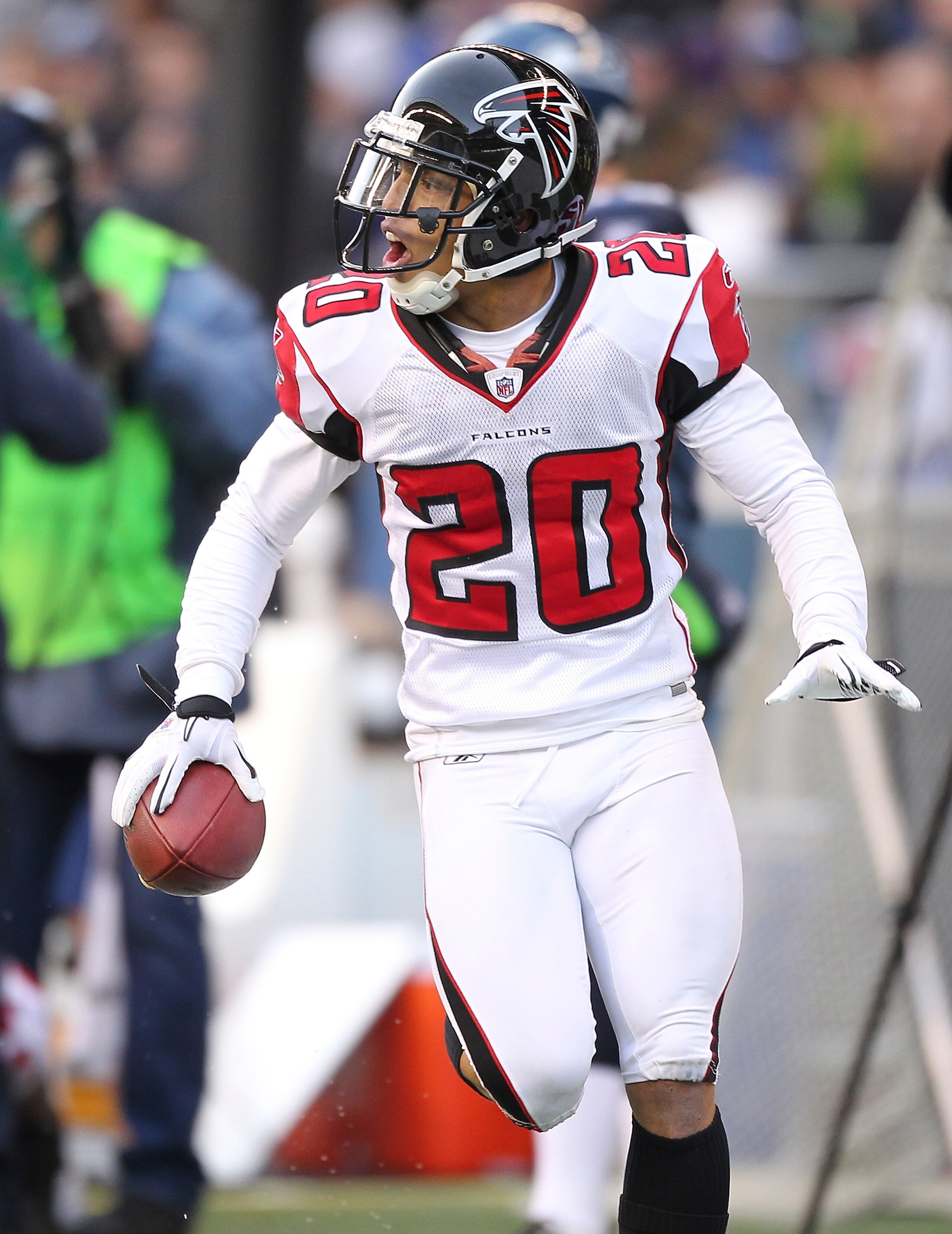 SEATTLE, WA - DECEMBER 19:  Brent Grimes #20 of the Atlanta Falcons celebrates after making an interception against the Seattle Seahawks at Qwest Field on December 19, 2010 in Seattle, Washington. The Falcons defeated the Seahawks 34-18. (Photo by Otto Gr
