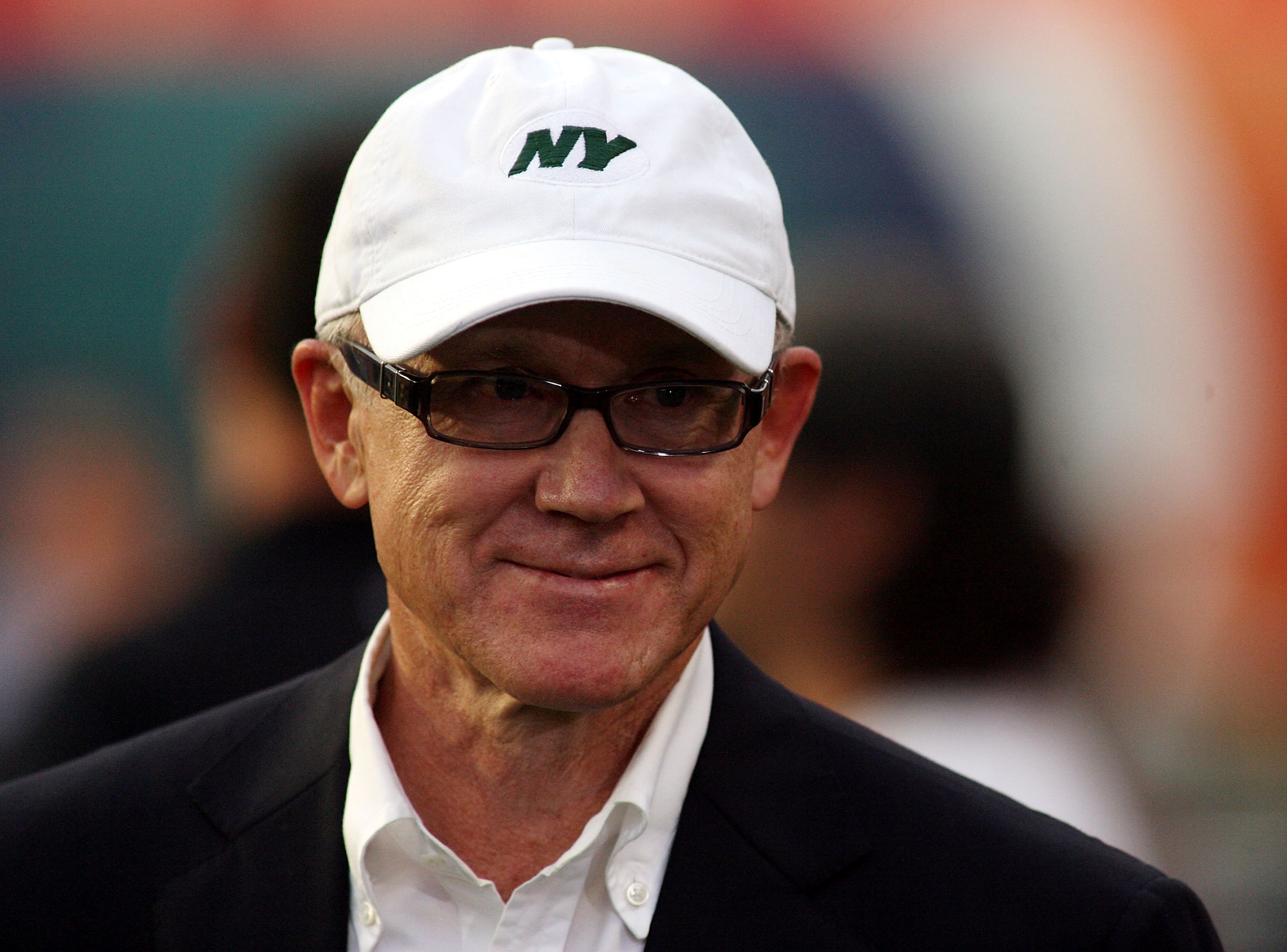 MIAMI - SEPTEMBER 26:  Owner Woody Johnson of the New York Jets smiles as his team warms up prior to playing the Miami Dolphins at Sun Life Stadium on September 26, 2010 in Miami, Florida.  (Photo by Marc Serota/Getty Images)