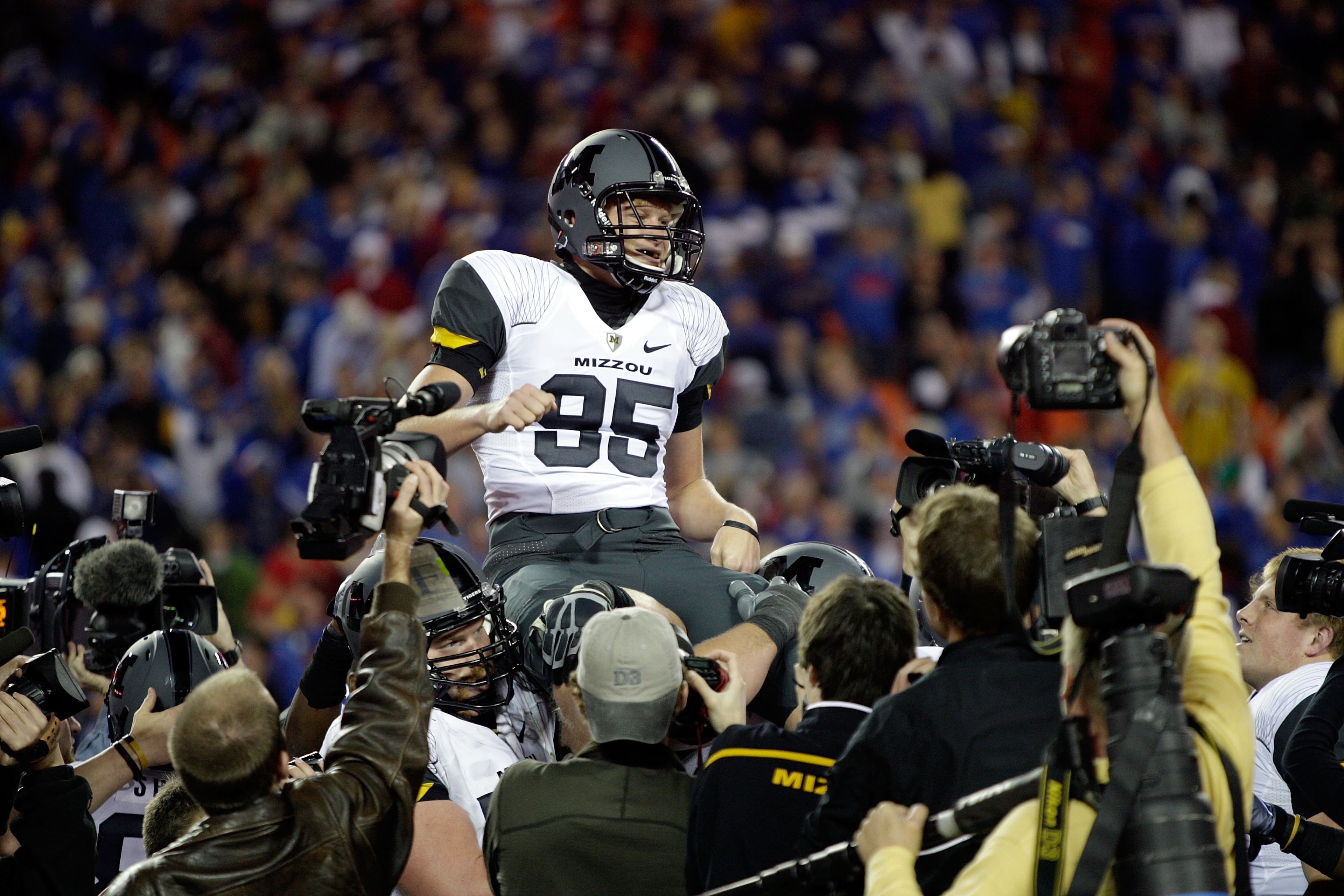 KANSAS CITY, MO - NOVEMBER 28:  Kicker Grant Ressel #95 of the Missouri Tigers is carried off the field after kicking the winning field goal to defeat the Kansas Jayhawks 41-39 to win the game at Arrowhead Stadium on November 28, 2009 in Kansas City, Miss