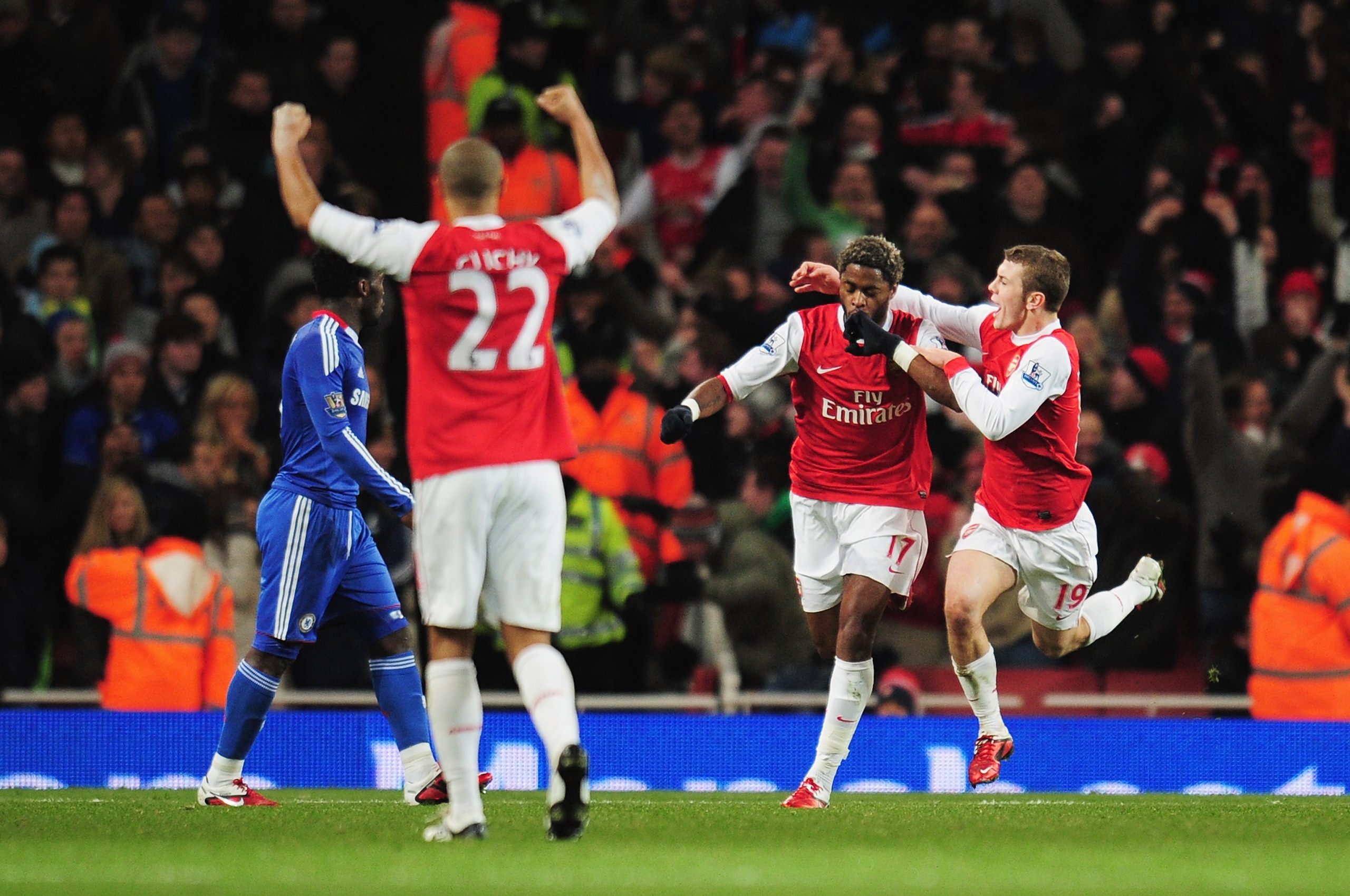 LONDON, ENGLAND - DECEMBER 27:  Alex Song (2ndR) of Arsenal celebrates scoring the opening goal with Jack Wilshere (R) during the Barclays Premier League match between Arsenal and Chelsea at the Emirates Stadium on December 27, 2010 in London, England.  (