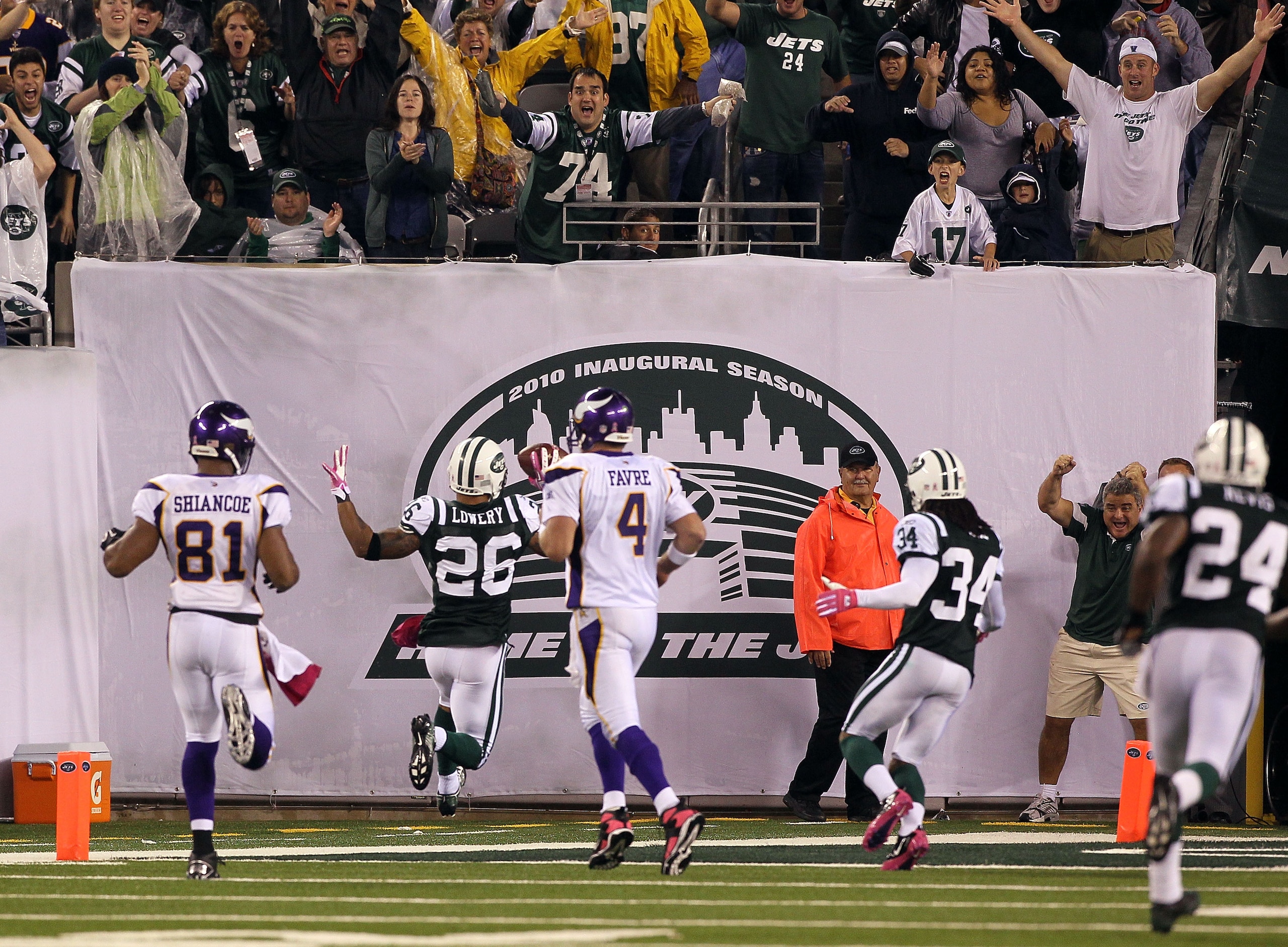 EAST RUTHERFORD, NJ - OCTOBER 11: Dwight Lowery #26 of the New York Jets scores a 26-yard interception return for a touchdown in the fourth quarter against Brett Favre #4 of the Minnesota Vikings at New Meadowlands Stadium on October 11, 2010 in East Ruth