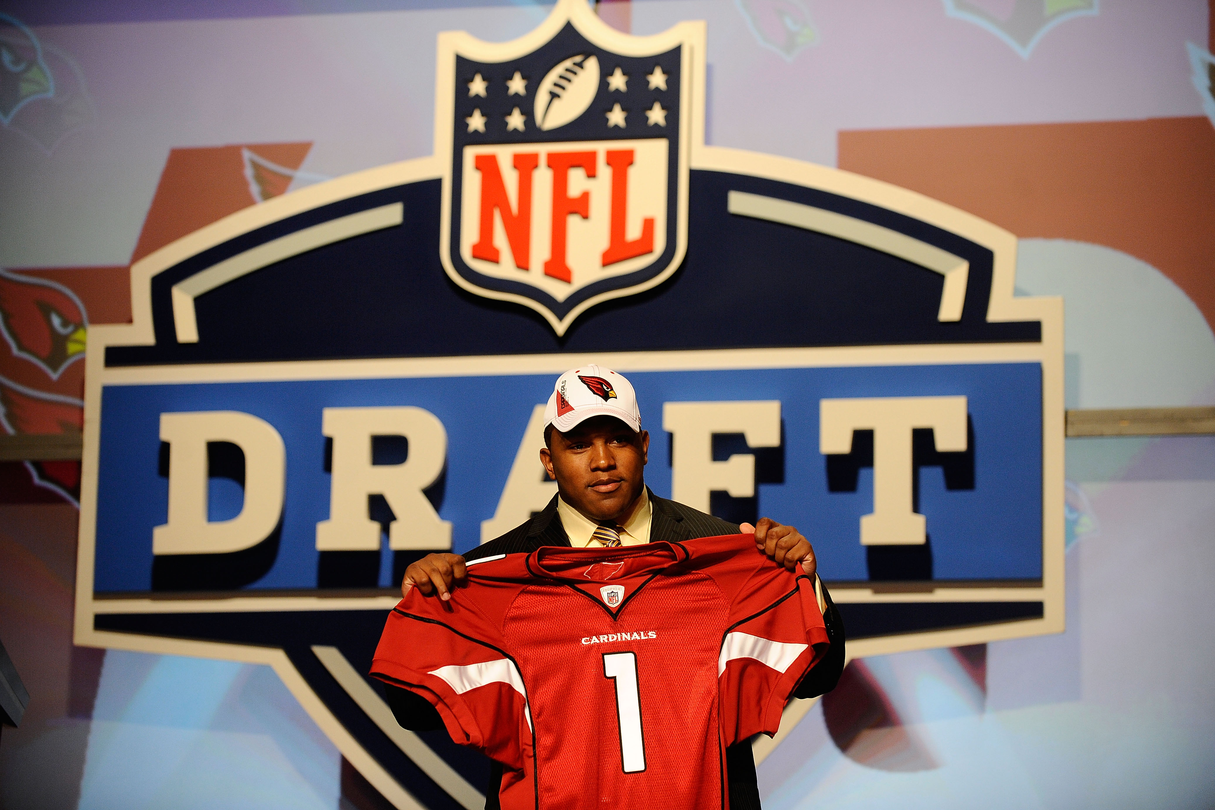 NEW YORK - APRIL 22:  Dan Williams from the Tennessee Volunteers holds up a Arizona Carinals jersey after he was selected number 26 overall by the Cardinals during the first round of the 2010 NFL Draft at Radio City Music Hall on April 22, 2010 in New Yor