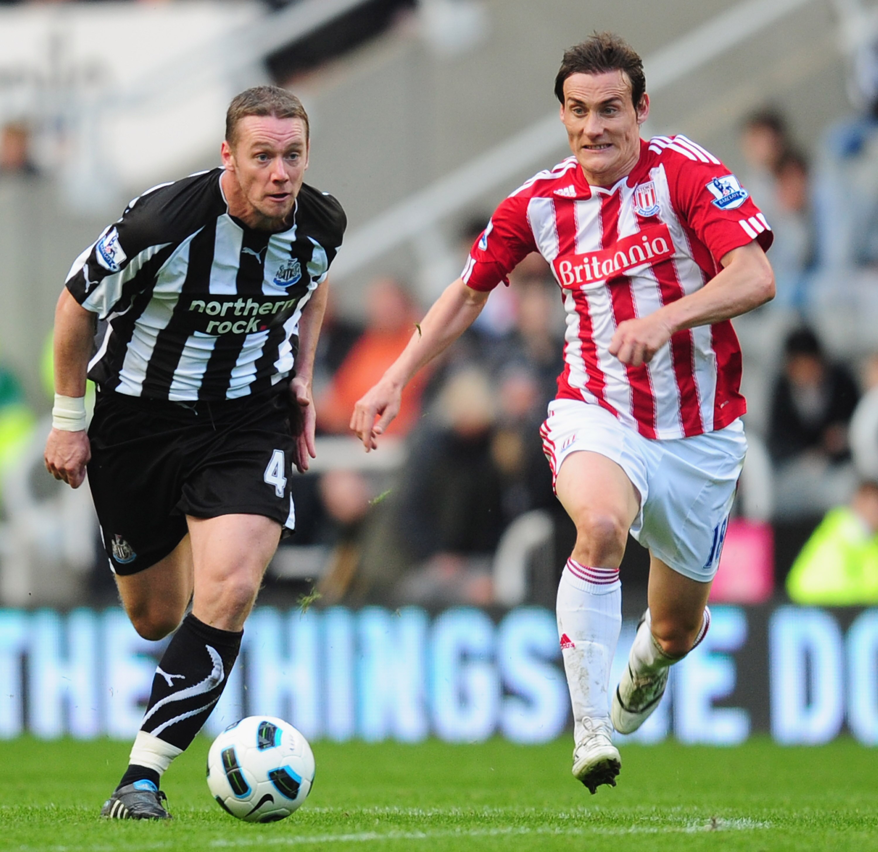 NEWCASTLE UPON TYNE, ENGLAND - SEPTEMBER 26:  Kevin Nolan of Newcastle is chased by Dean Whitehead of Stoke during the Barclays Premier League match between Newcastle United and Stoke City at St James' Park on September 26, 2010 in Newcastle upon Tyne, En