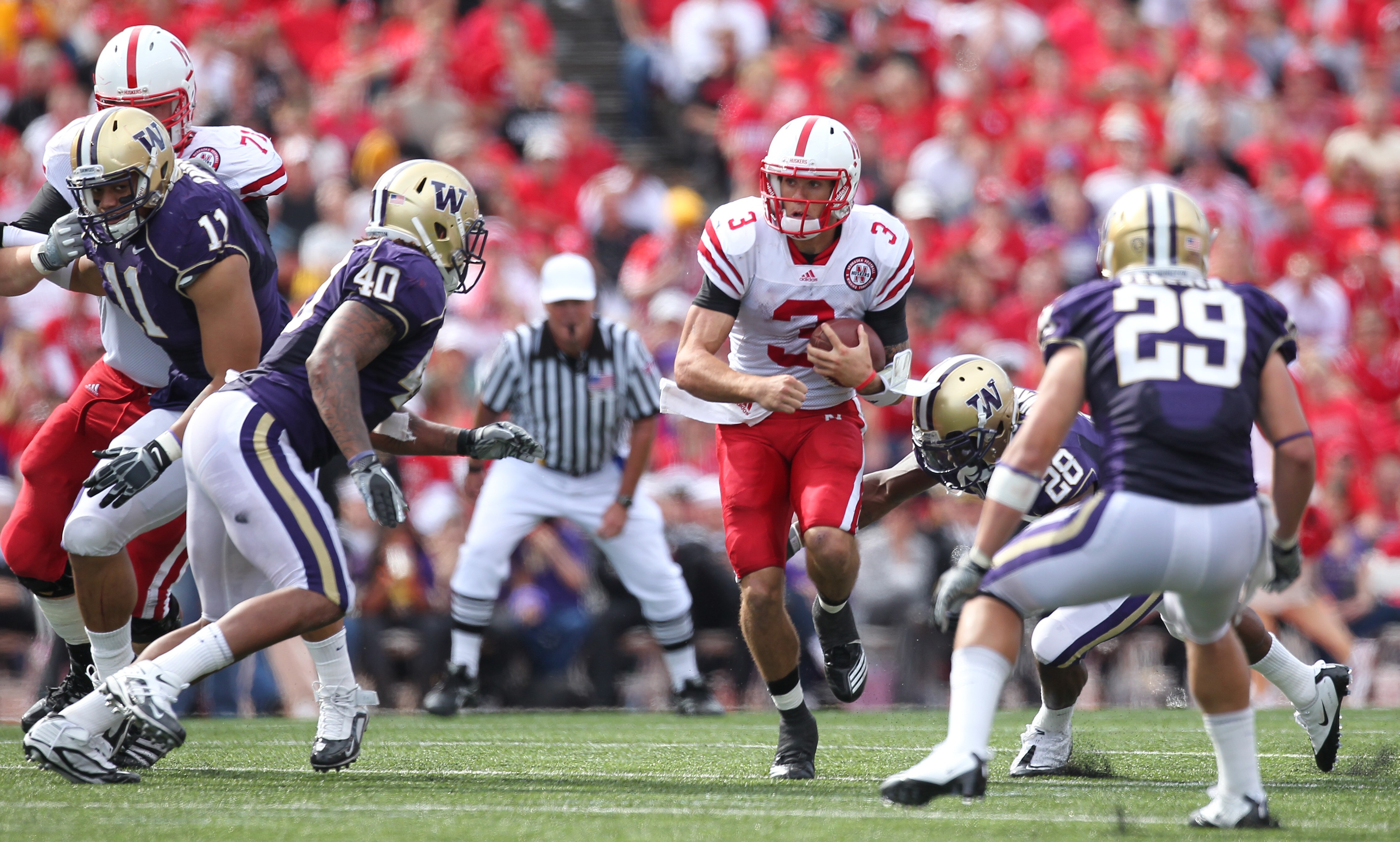 SEATTLE - SEPTEMBER 18: Quarterback Taylor Martinez #3 of the Nebraska Cornhuskers rushes against the Washington Huskies on September 18, 2010 at Husky Stadium in Seattle, Washington. (Photo by Otto Greule Jr/Getty Images)