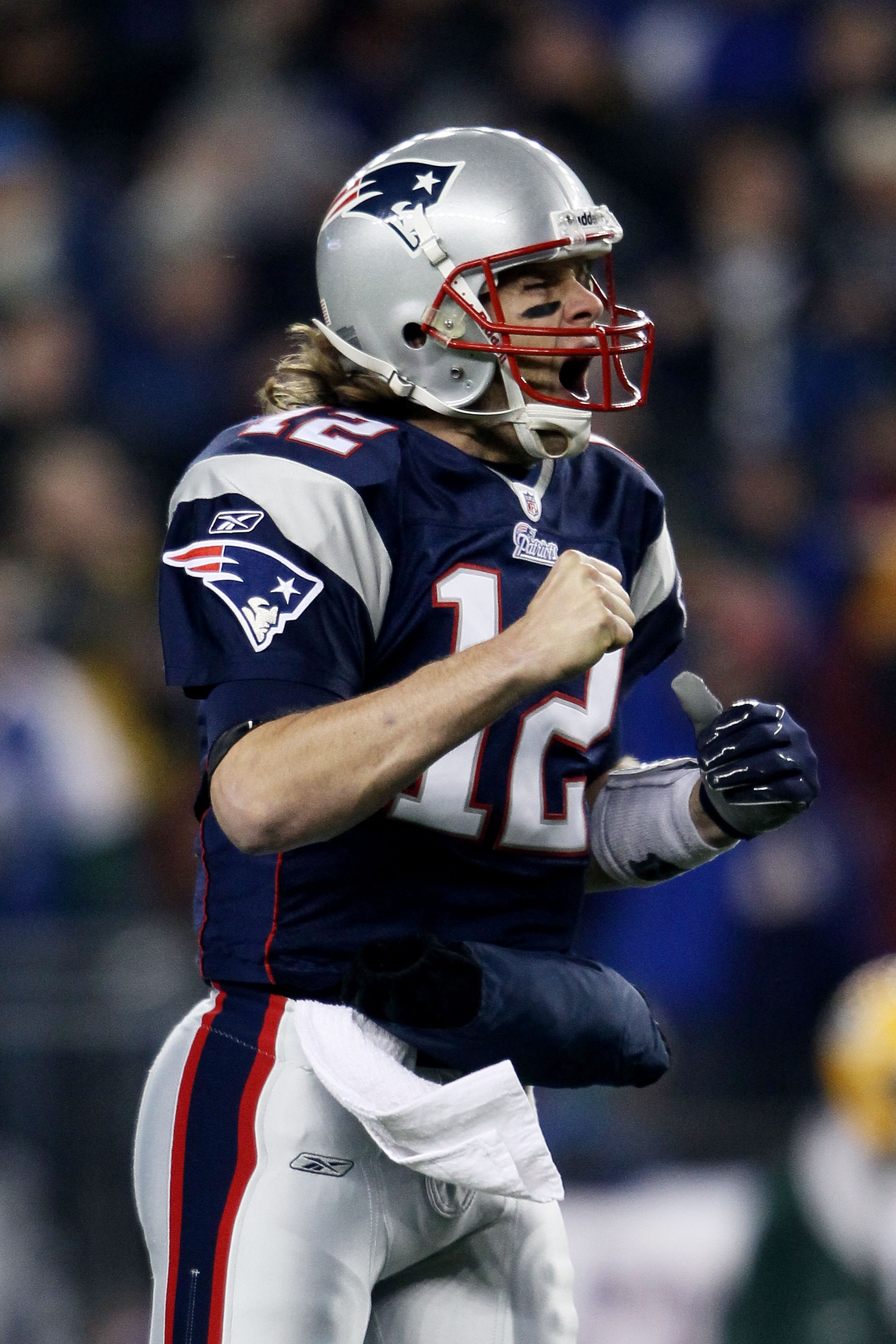 FOXBORO, MA - DECEMBER 19:  Quarterback Tom Brady #12 of the New England Patriots celebrates a touchdown scored by running back BenJarvus Green-Ellis #42 (not pictured) against the Green Bay Packers in the first quarter of the game at Gillette Stadium on