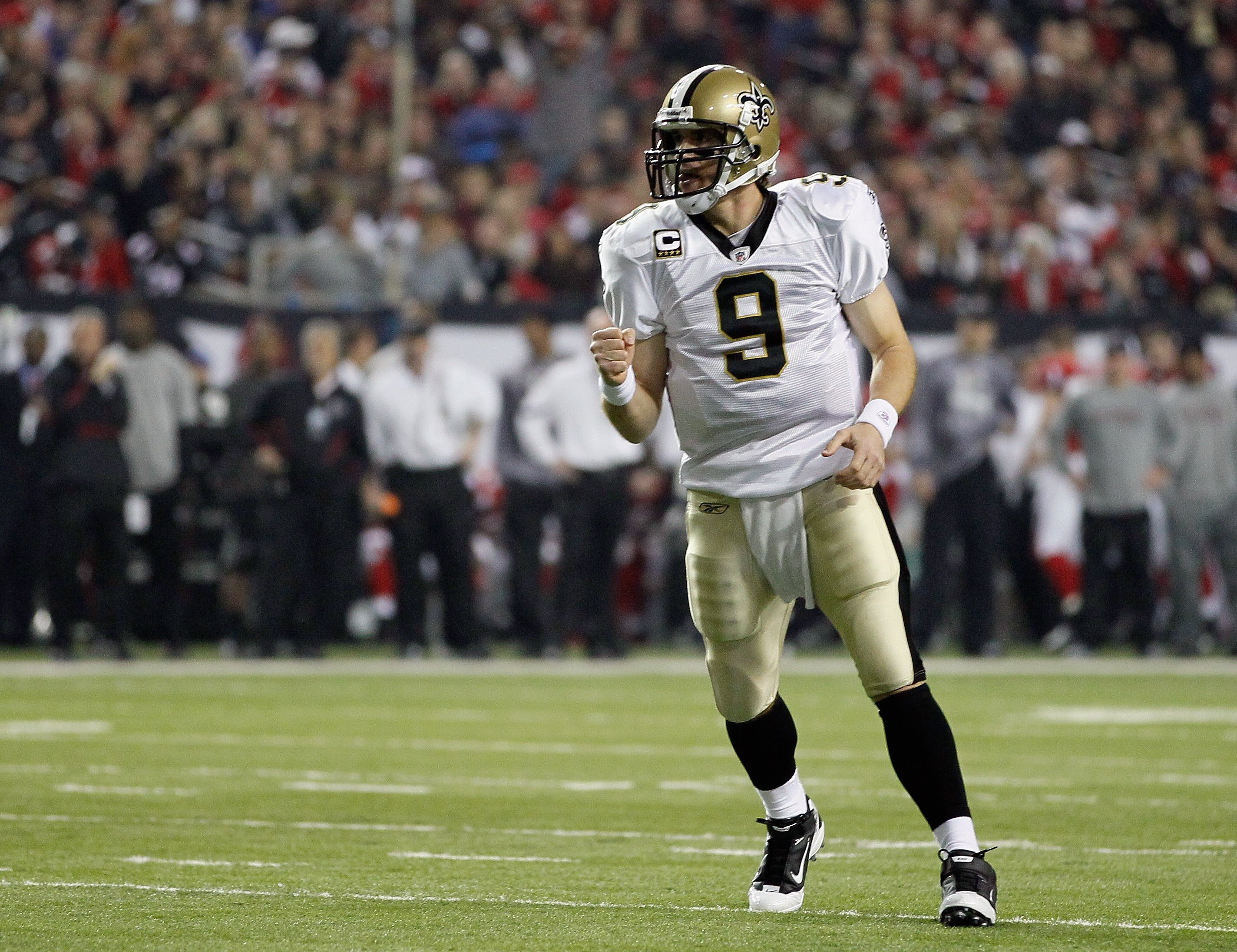ATLANTA, GA - DECEMBER 27:  Quarterback Drew Brees #9 of the New Orleans Saints celebrates a touchdown pass in the first half during the game against the Atlanta Falcons at the Georgia Dome on December 27, 2010 in Atlanta, Georgia.  (Photo by Kevin C. Cox