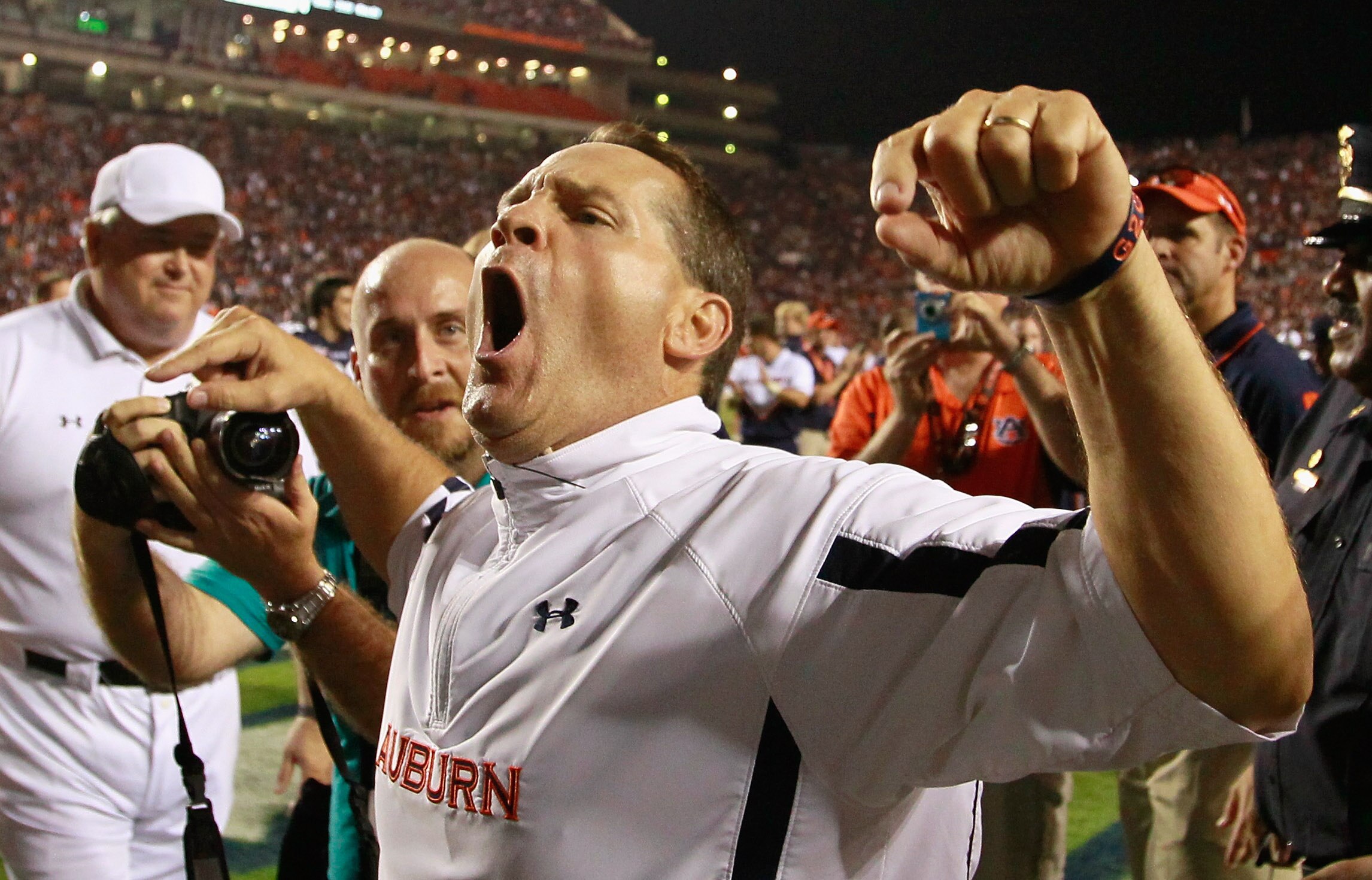AUBURN, AL - SEPTEMBER 18:  Head coach Gene Chizik of the Auburn Tigers celebrates after their 27-24 overtime win over the Clemson Tigers at Jordan-Hare Stadium on September 18, 2010 in Auburn, Alabama.  (Photo by Kevin C. Cox/Getty Images)