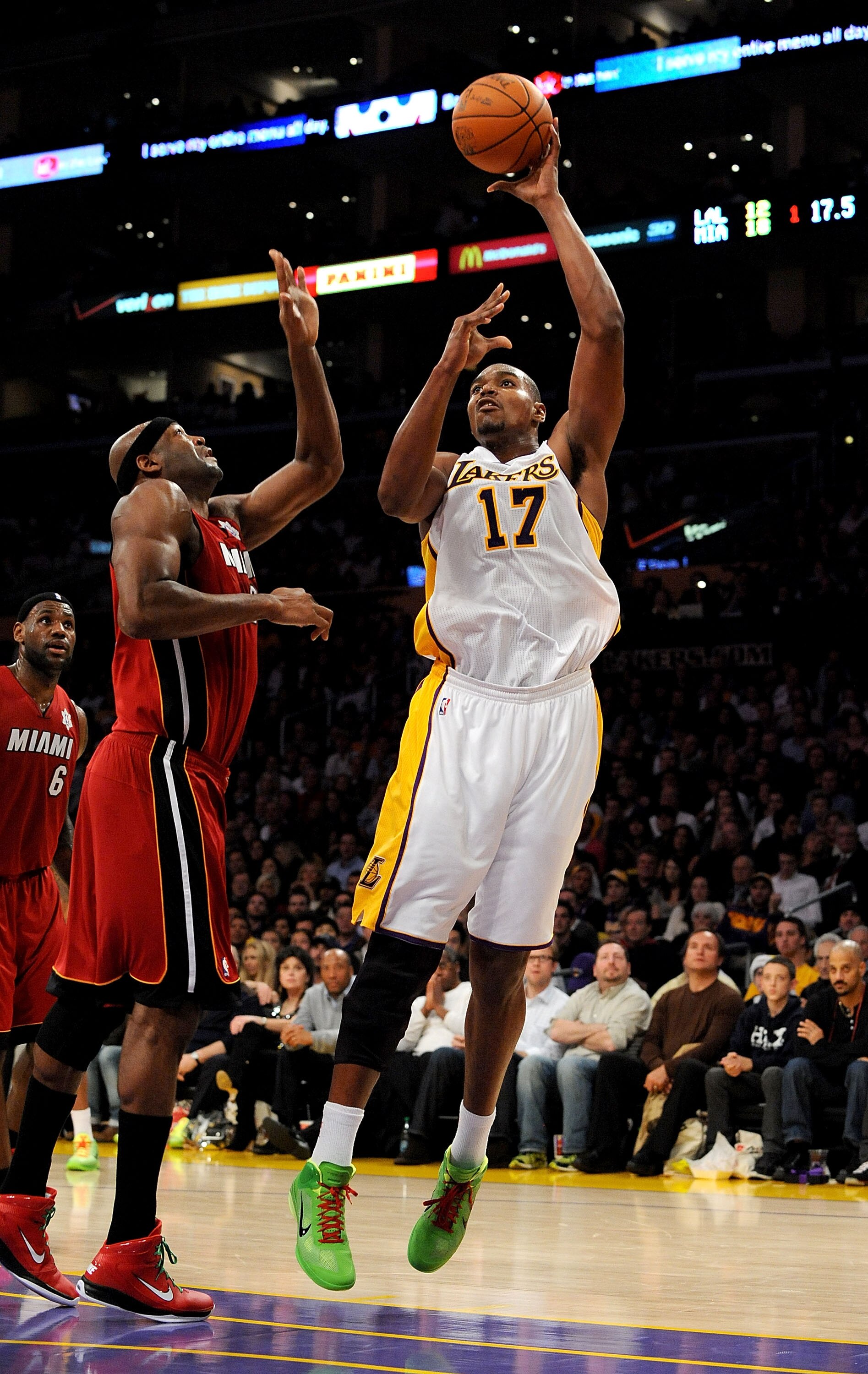 LOS ANGELES, CA - DECEMBER 25:  Andrew Bynum #17 of the Los Angeles Lakers puts a shot up against Erick Dampier #25 of the Miami Heat at Staples Center on December 25, 2010 in Los Angeles, California. NOTE TO USER: User expressly acknowledges and agrees t