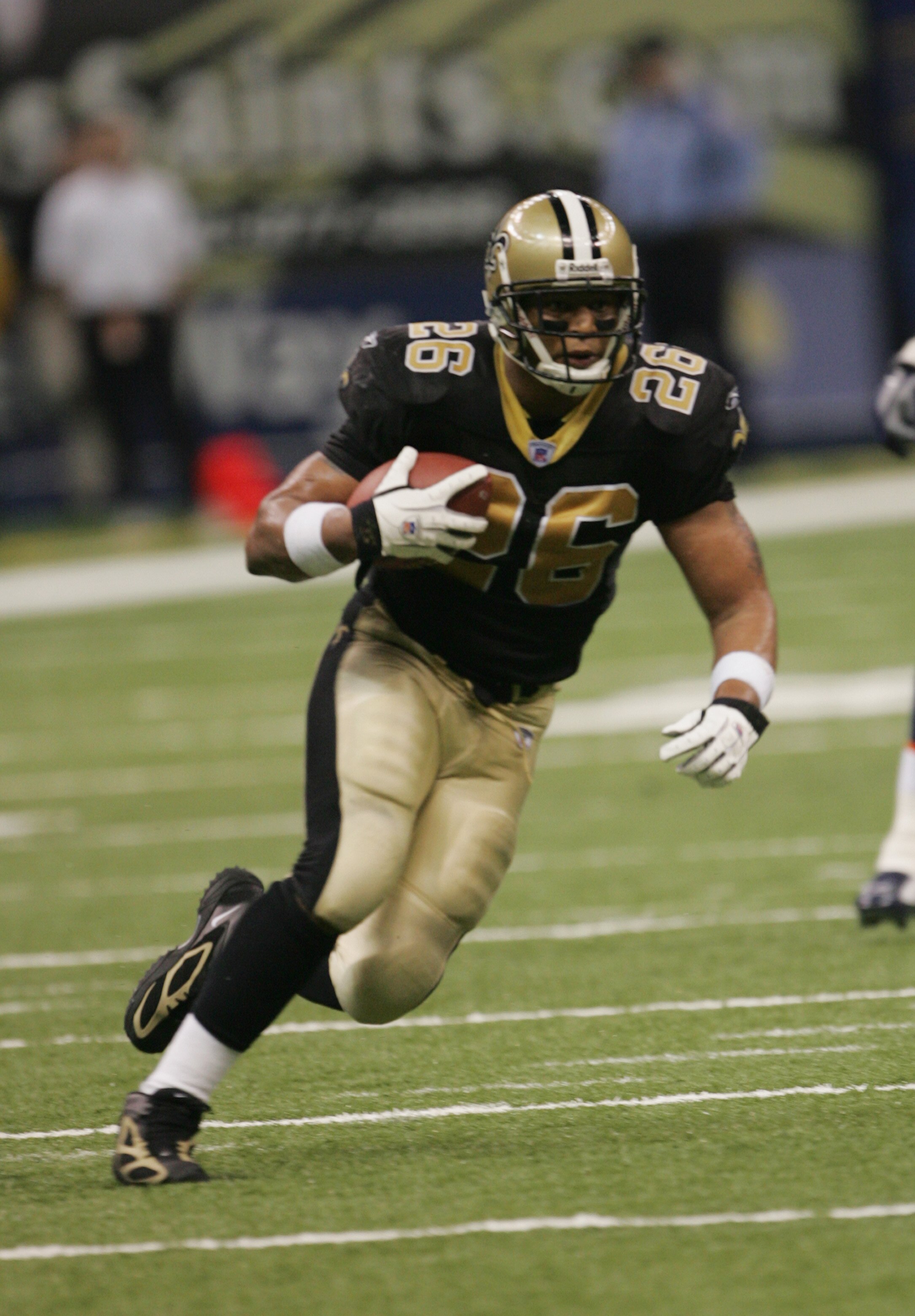 NEW ORLEANS - NOVEMBER 21:  Running back Deuce McAllister #26 of the New Orleans Saints carries the ball during the game against the Denver Broncos on November 21, 2004 at the Louisiana Superdome in New Orleans, Louisiana.  The Broncos defeated the Saints