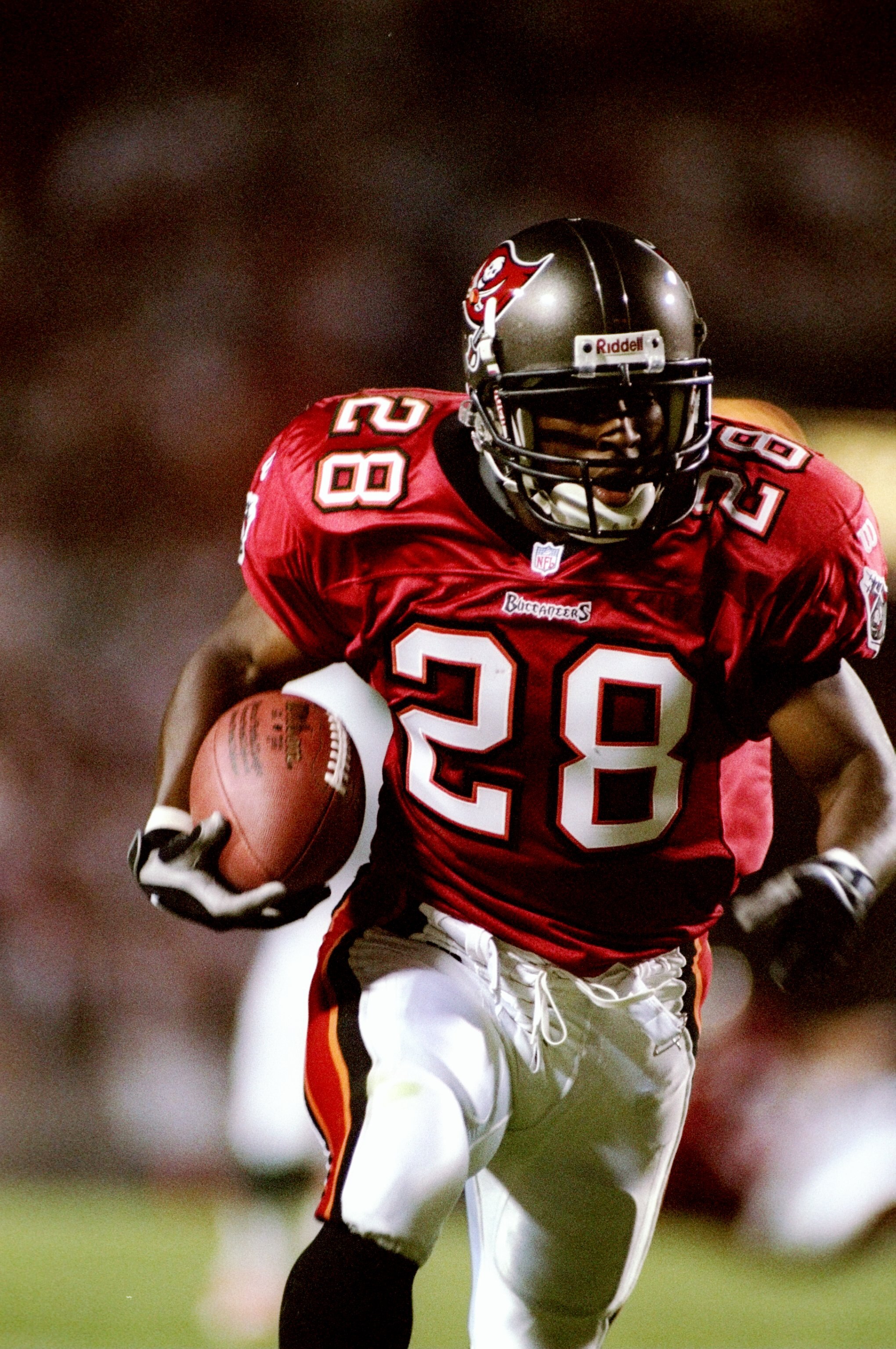 21 Sep 1997:  Running back Warrick Dunn #28 of the Tampa Bay Buccaneers carries the football during the Buccaneers 31-21 win over the Miami Dolphins at Houlihan''s Stadium in Tampa, Florida. Mandatory Credit: Scott Halleran  /Allsport