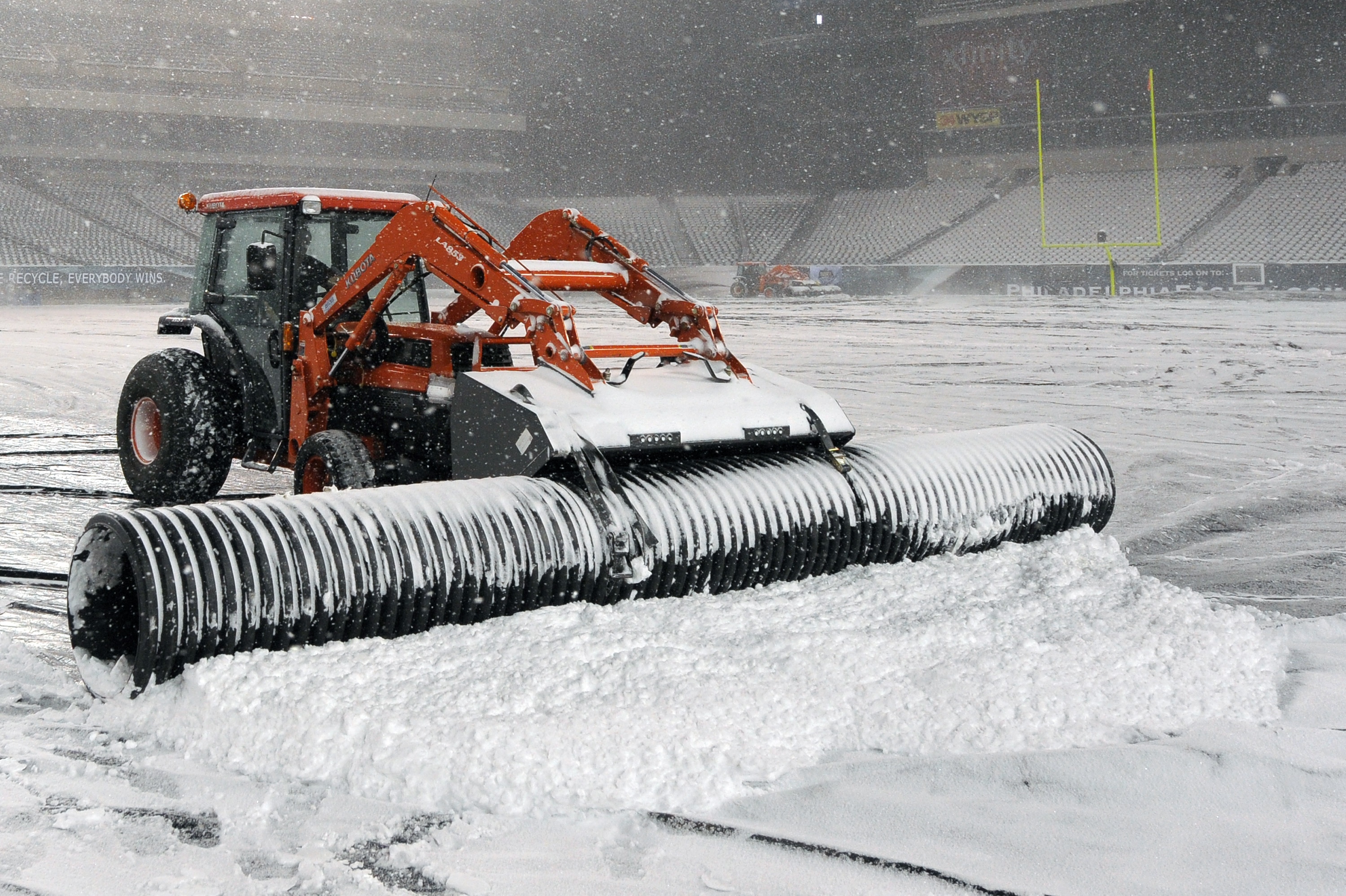 PHILADELPHIA - DECEMBER 26: A plow works to remove snow from the playing surface at Lincoln Financial Field on December 26, 2010 in Philadelphia, Pennsylvania. The game between the Minnesota Vikings and Philadelphia Eagles was postponed by the NFL.(Photo