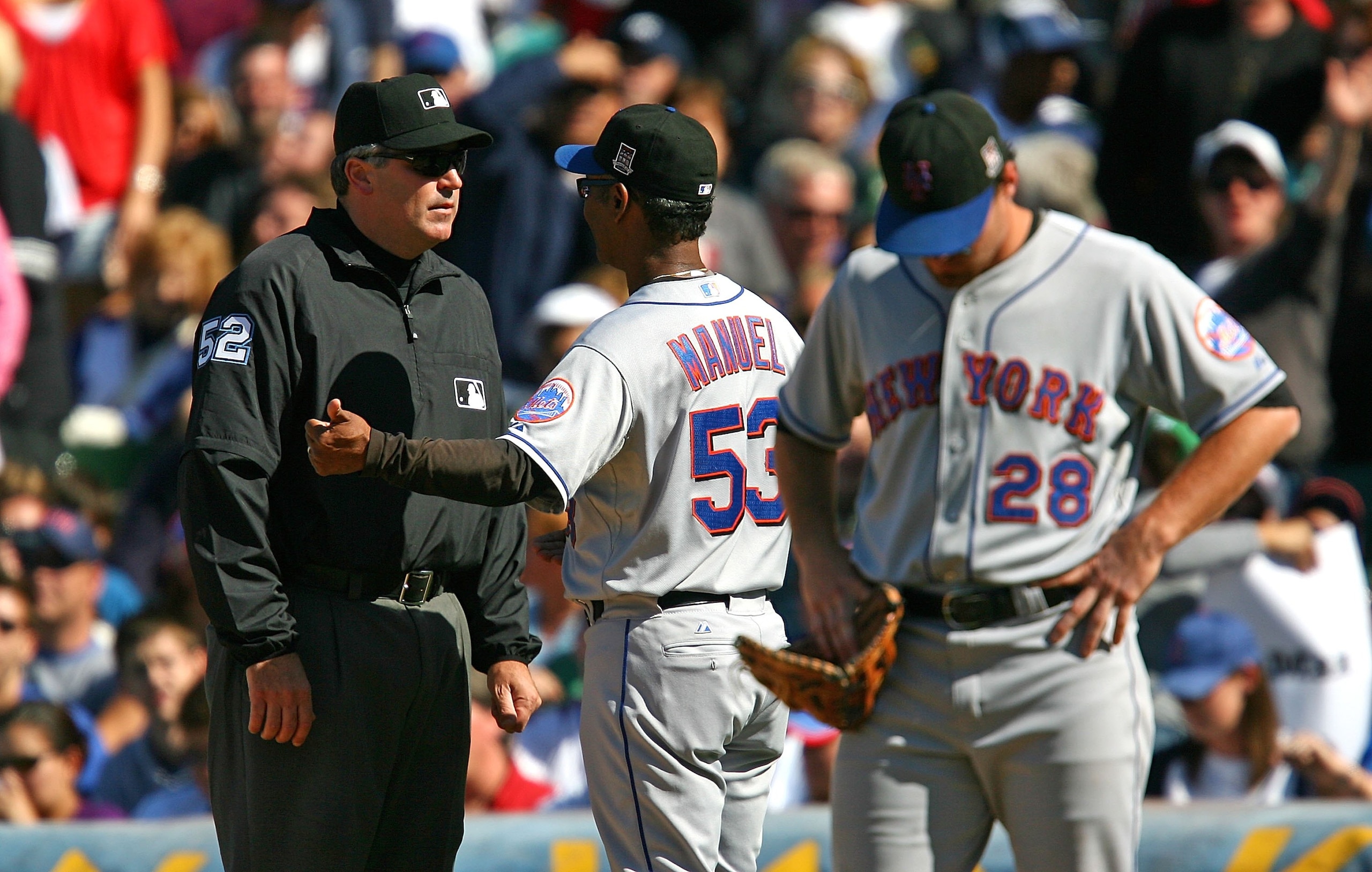 CHICAGO - AUGUST 30: Manager Jerry Manuel #53 of the New York Mets argues with first base umpire Bill Welke #52 as Daniel Murphy #28 waits during a game against the Chicago Cubs on August 30, 2009 at Wrigley Field in Chicago, Illinois. The Mets defeated t CHICAGO - AUGUST 30: Manager Jerry Manuel #53 of the New York Mets argues with first base umpire Bill Welke #52 as Daniel Murphy #28 waits during a game against the Chicago Cubs on August 30, 2009 at Wrigley Field in Chicago, Illinois. The Mets defeated t