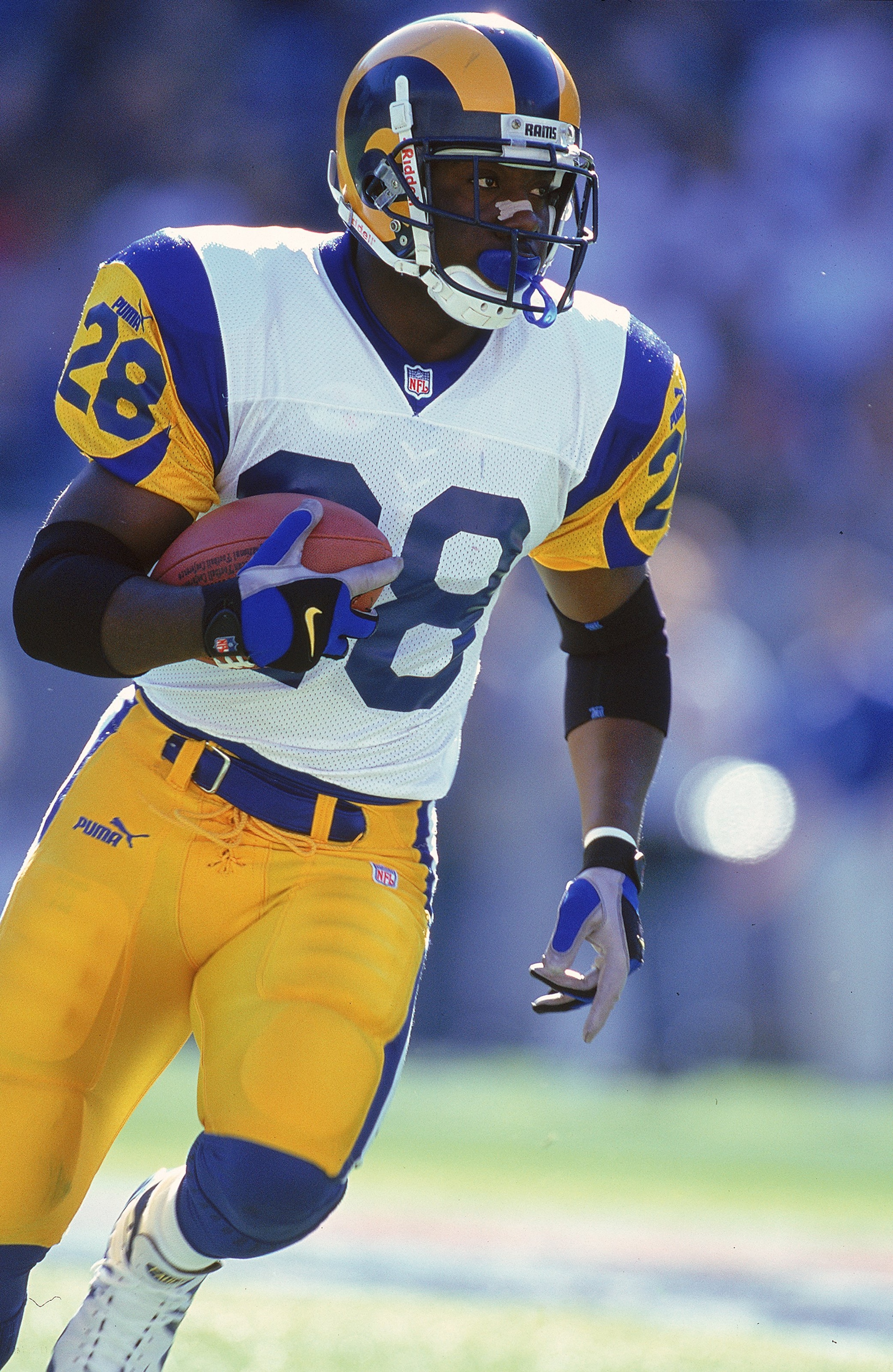 5 Dec 1999: Marshall Faulk #28 of the St. Louis Rams runs with the ball during the game against the Carolina Panthers at the Ericsson Stadium in Charlotte, North Carolina. The Rams defeated the Panthers 34-21. Mandatory Credit: Al Bello /Allsport 5 Dec 1999: Marshall Faulk #28 of the St. Louis Rams runs with the ball during the game against the Carolina Panthers at the Ericsson Stadium in Charlotte, North Carolina. The Rams defeated the Panthers 34-21. Mandatory Credit: Al Bello /Allsport