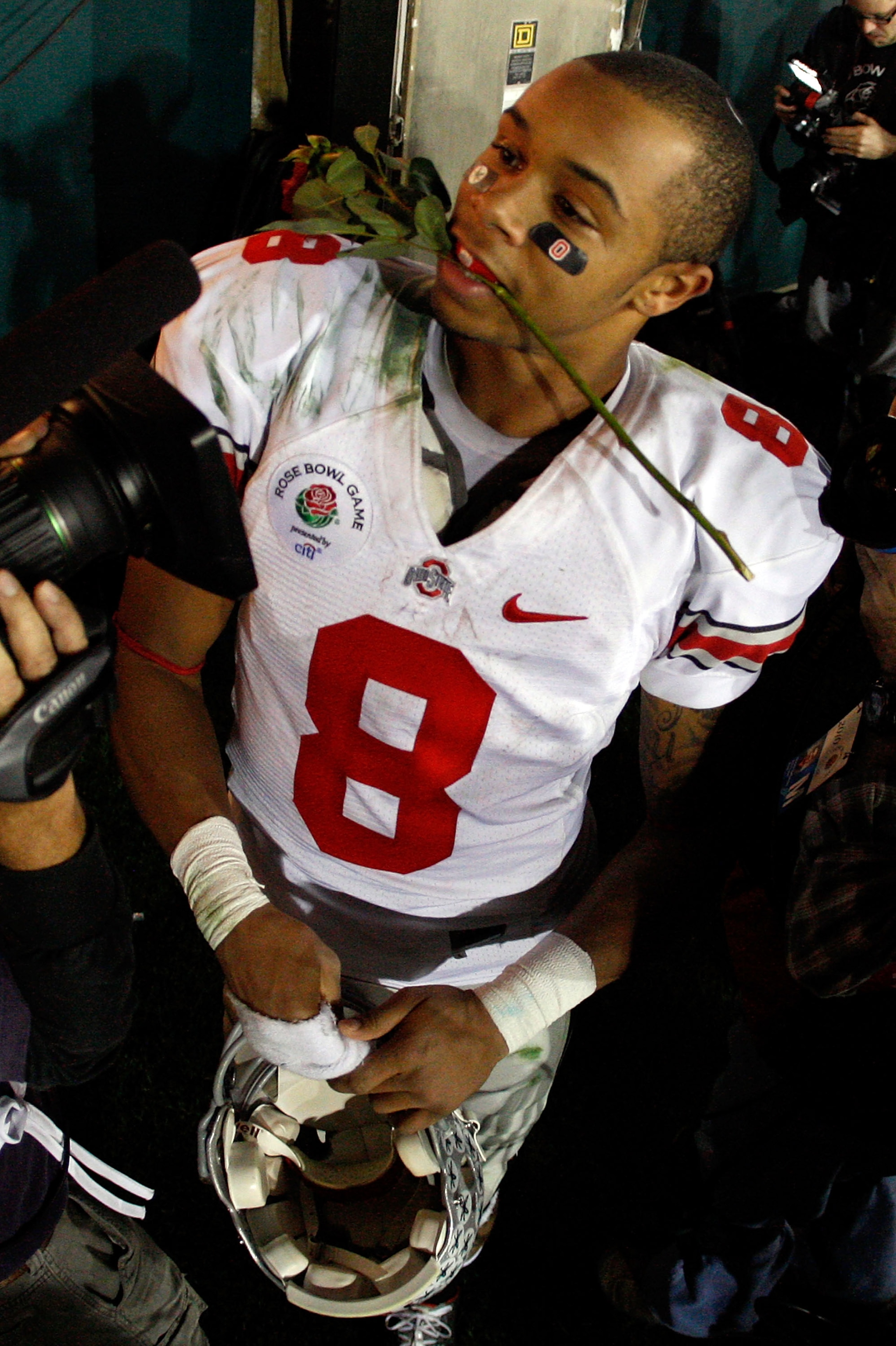 PASADENA, CA - JANUARY 01:  Wide receiver DeVier Posey #8 of the Ohio State Buckeyes celebrates after the Buckeyes 26-17 win over the Oregon Ducks in the 96th Rose Bowl game on January 1, 2010 in Pasadena, California.  (Photo by Harry How/Getty Images)