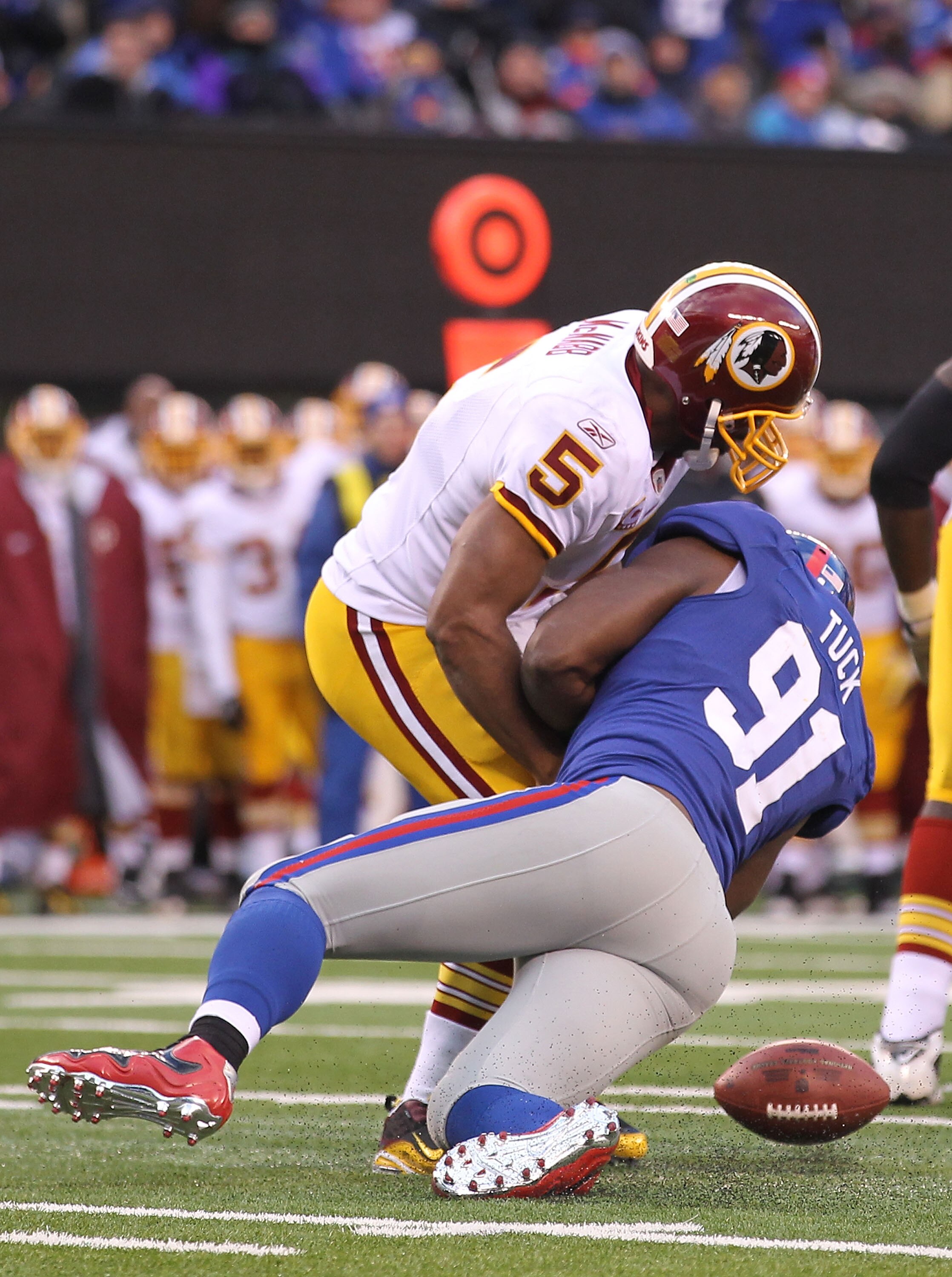 EAST RUTHERFORD, NJ - DECEMBER 05:  Justin Tuck #91 of the New York Giants sacks Donovan McNabb #5 of the Washington Redskins who fumbles and loses the ball during their game on December 5, 2010 at The New Meadowlands Stadium in East Rutherford, New Jerse