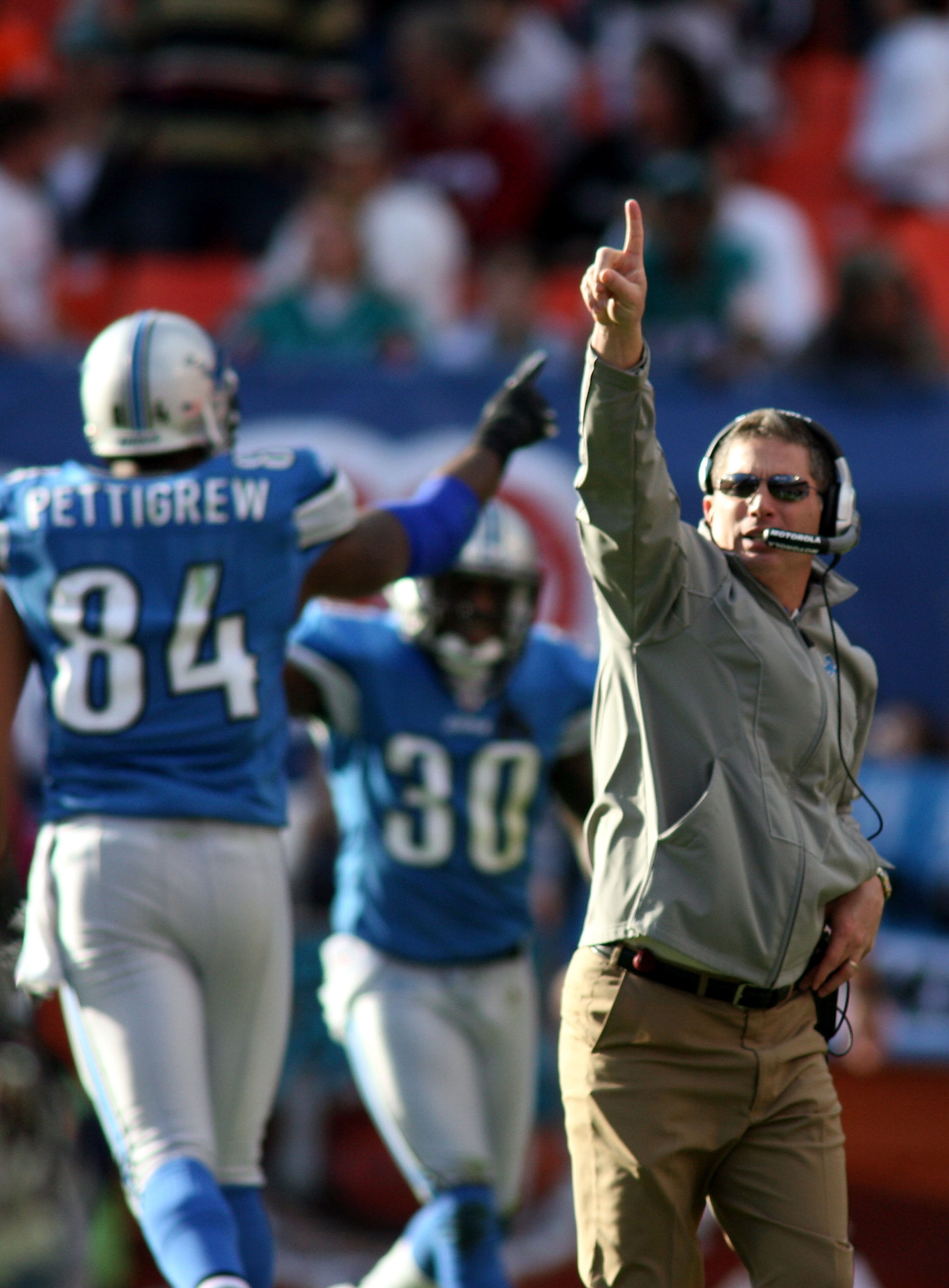 MIAMI - DECEMBER 26: Coach Jim Schwartz of the Detroit Lions celebrates a touchdown against the Miami Dolphins at Sun Life Stadium on December 26, 2010 in Miami, Florida. The Lions defeated the Dolphins 34-27.  (Photo by Marc Serota/Getty Images)